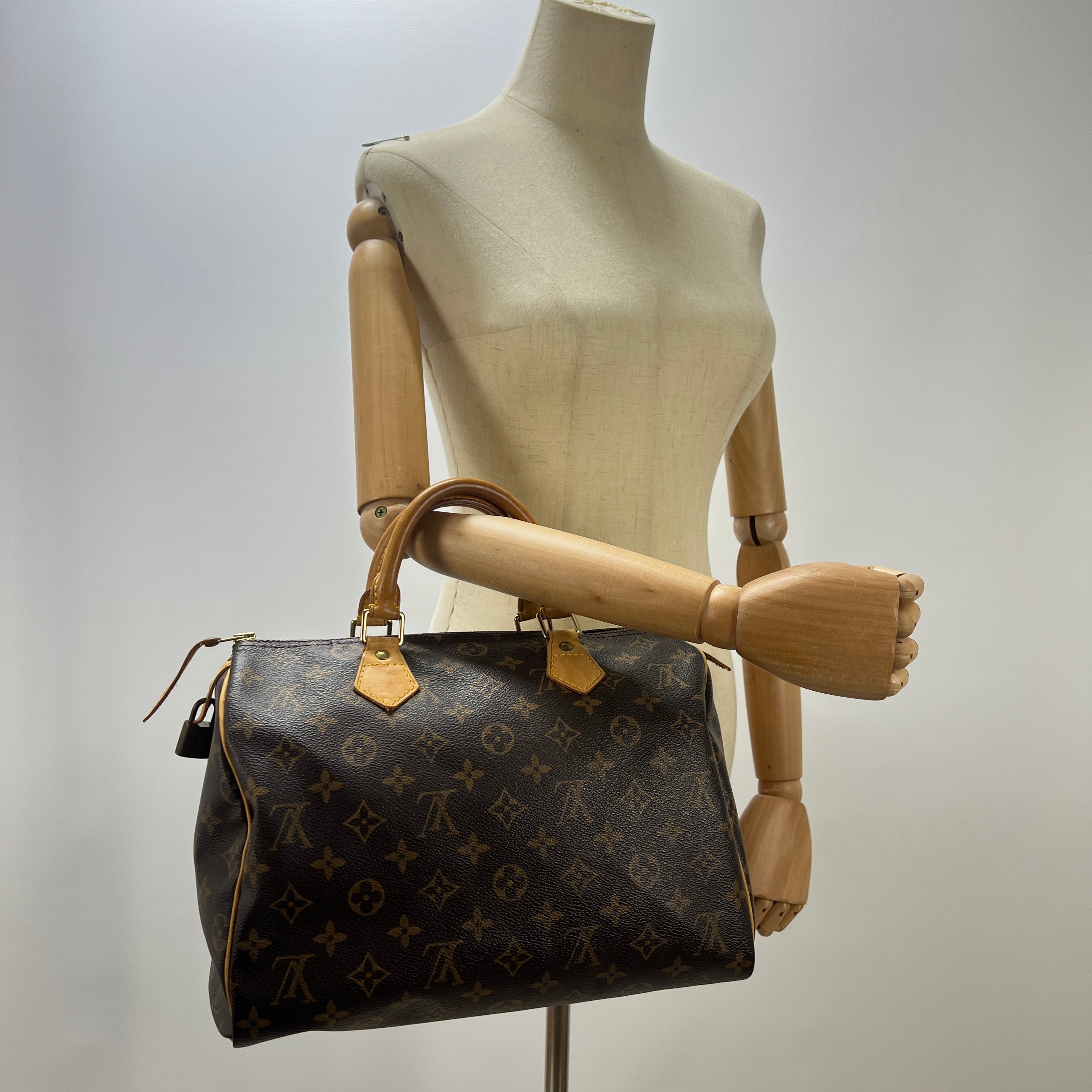 LOUIS VUITTON Speedy 30 canvas and brown leather handbag