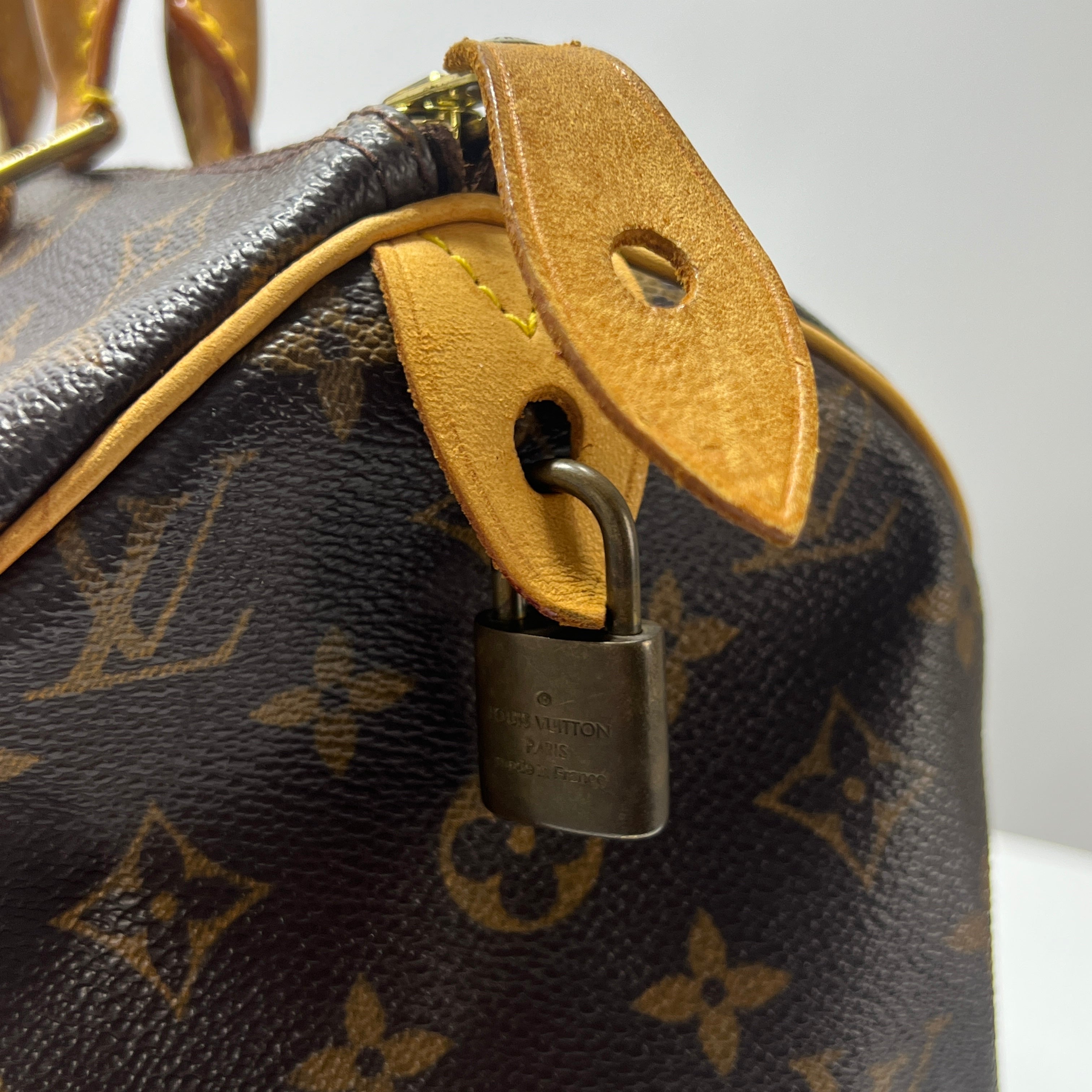 LOUIS VUITTON Speedy 30 canvas and brown leather handbag