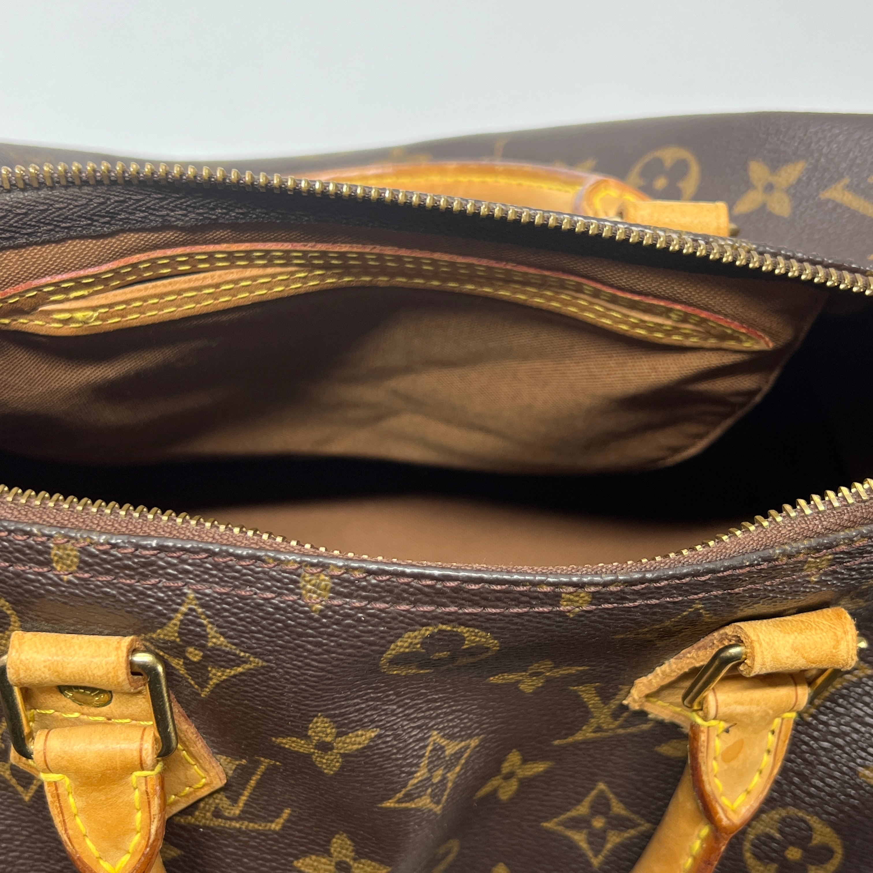 LOUIS VUITTON Speedy 30 canvas and brown leather handbag