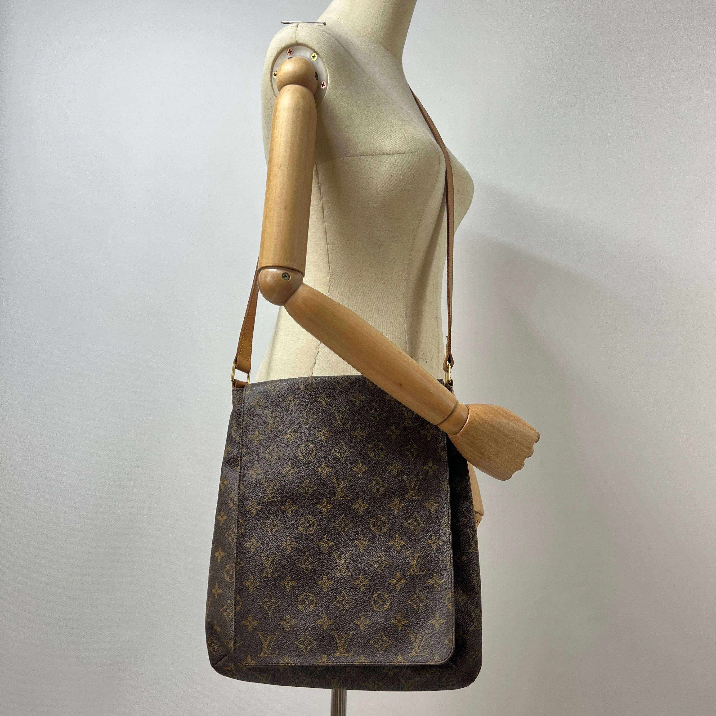 LOUIS VUITTON Tango canvas and brown leather handbag