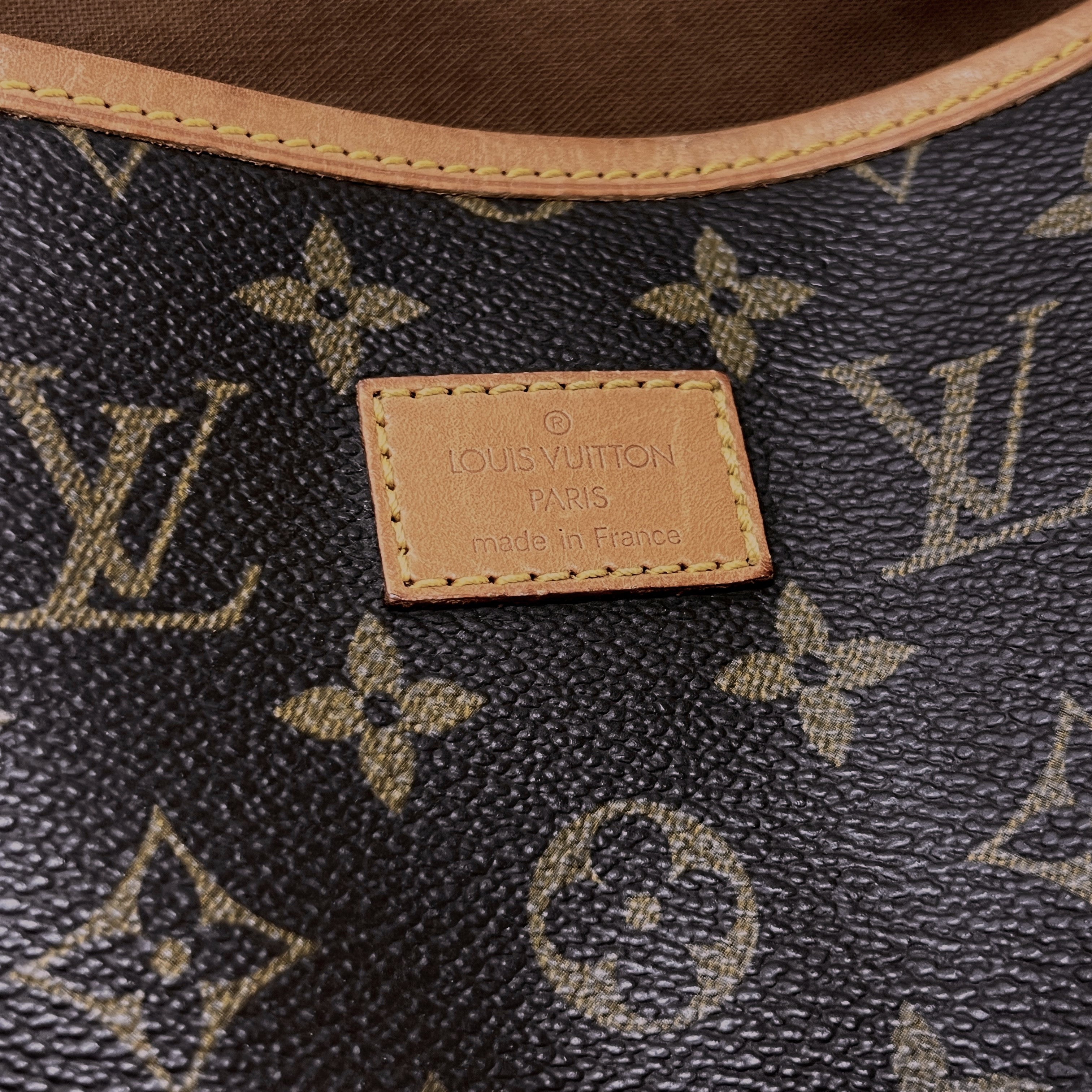 LOUIS VUITTON Saumur 30 canvas and brown leather handbag