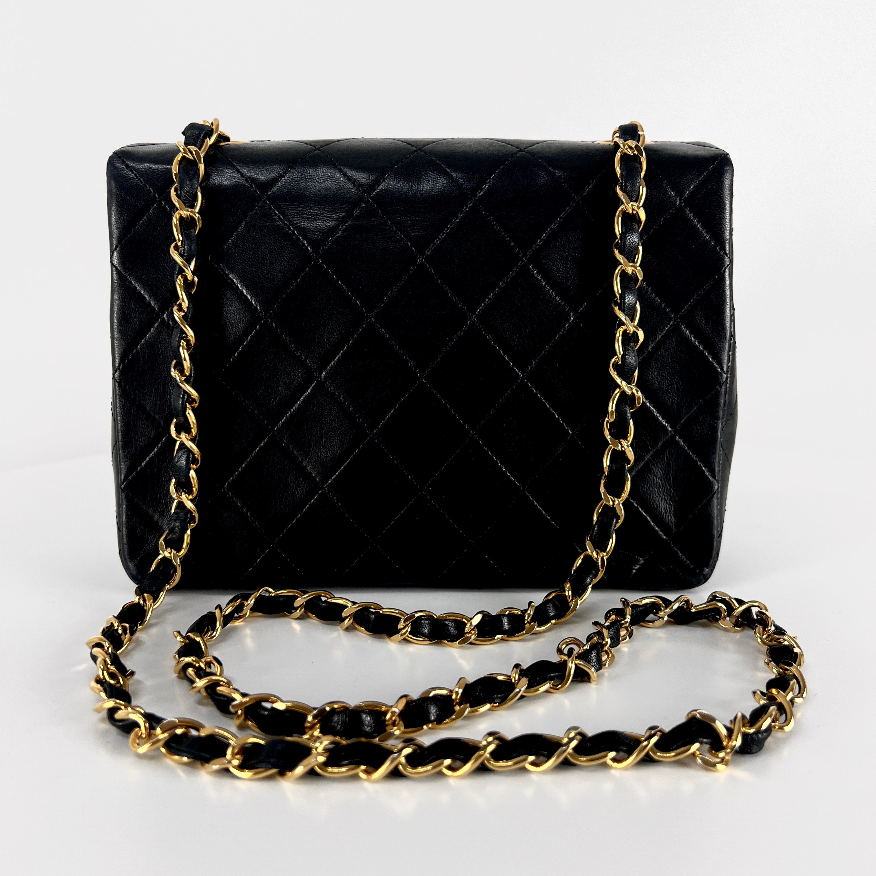 CHANEL Timeless classic mini flap black leather handbag