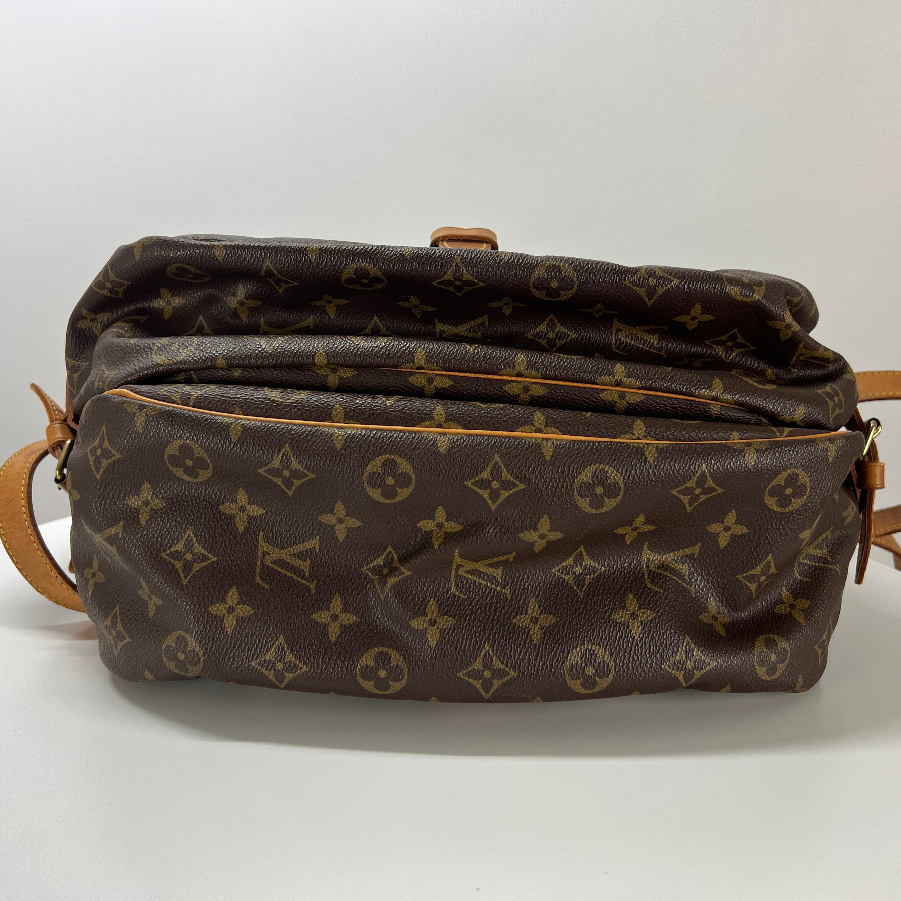 LOUIS VUITTON Saumur 30 canvas and brown leather handbag