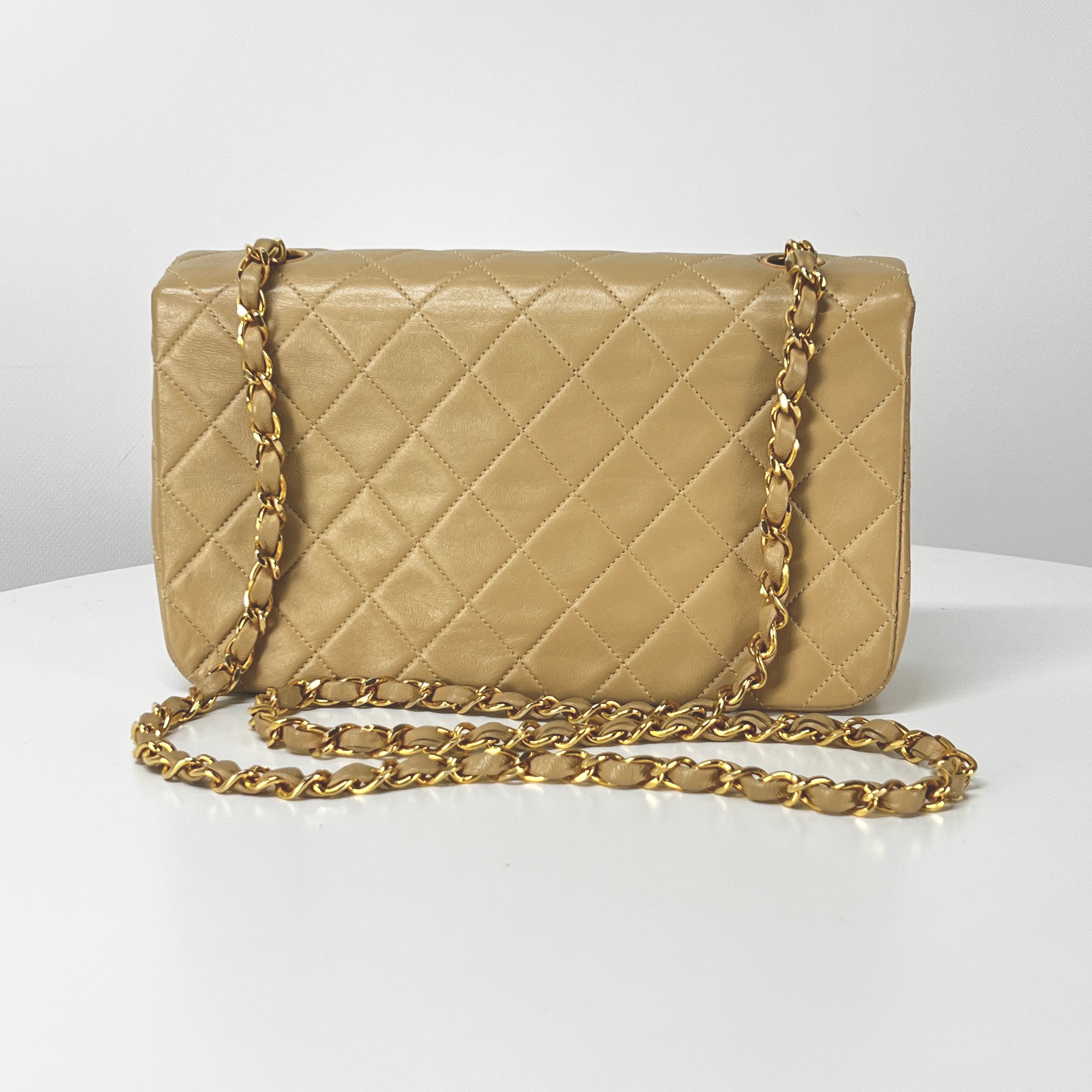 CHANEL Timeless classic quilted single flap beige leather handbag