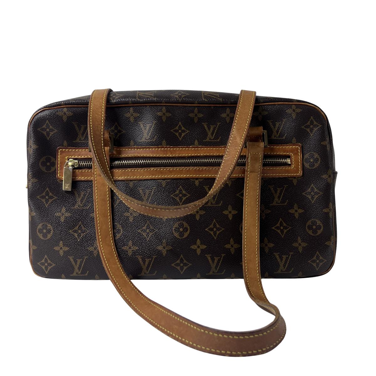 Sac à main LOUIS VUITTON Cité MM toile et cuir marron