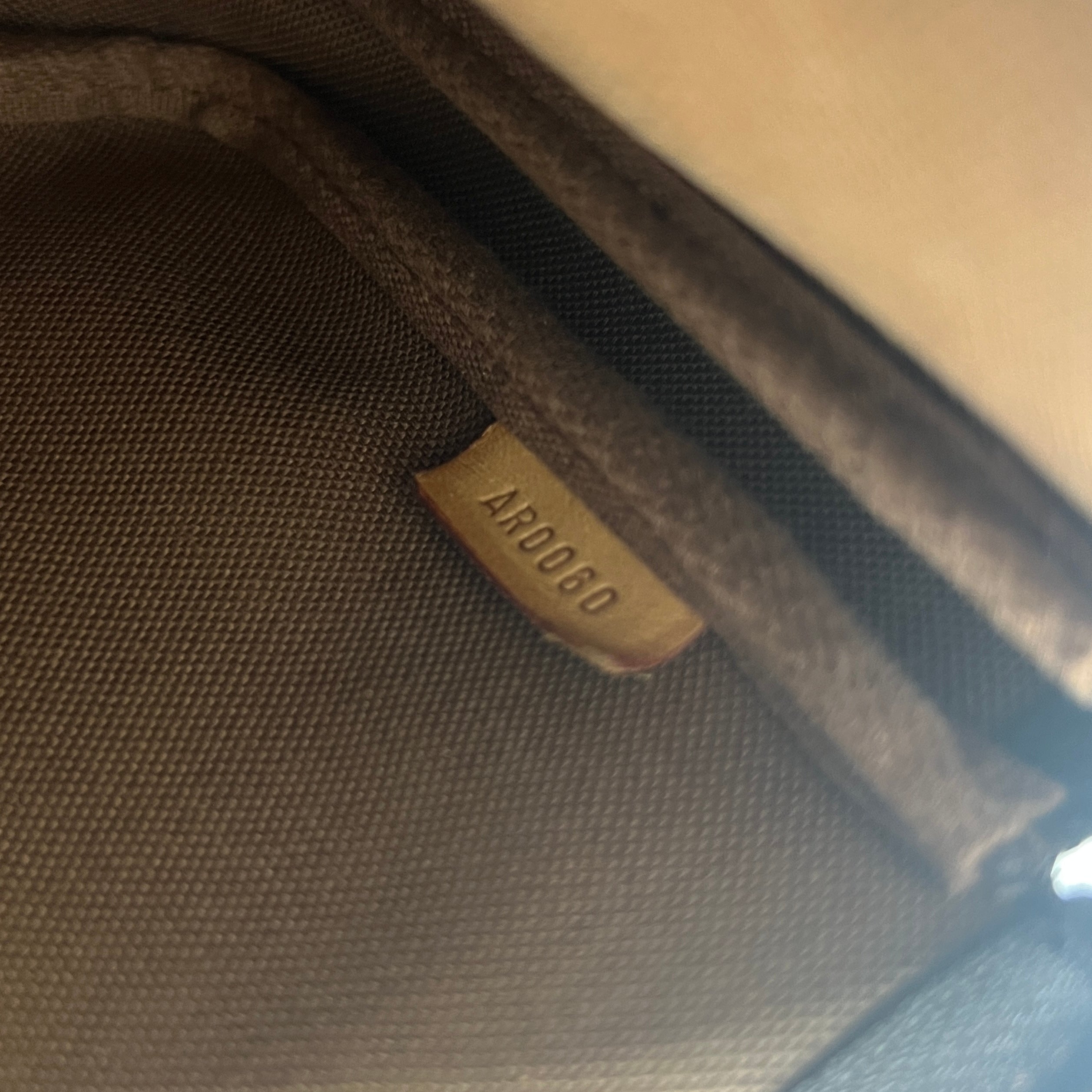 LOUIS VUITTON Pochette Accessory handbag in brown canvas and leather