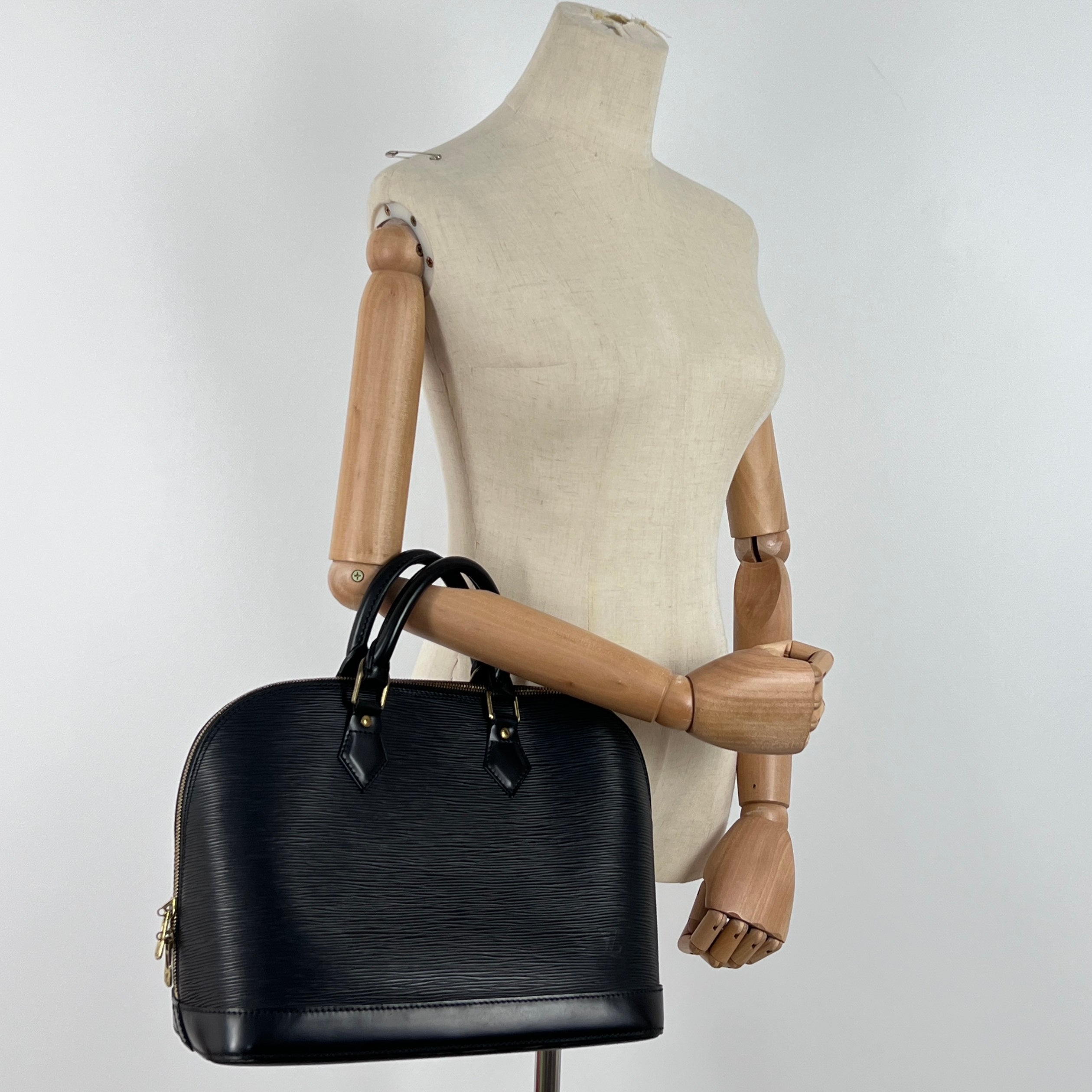 LOUIS VUITTON Alma PM handbag in black Epi leather