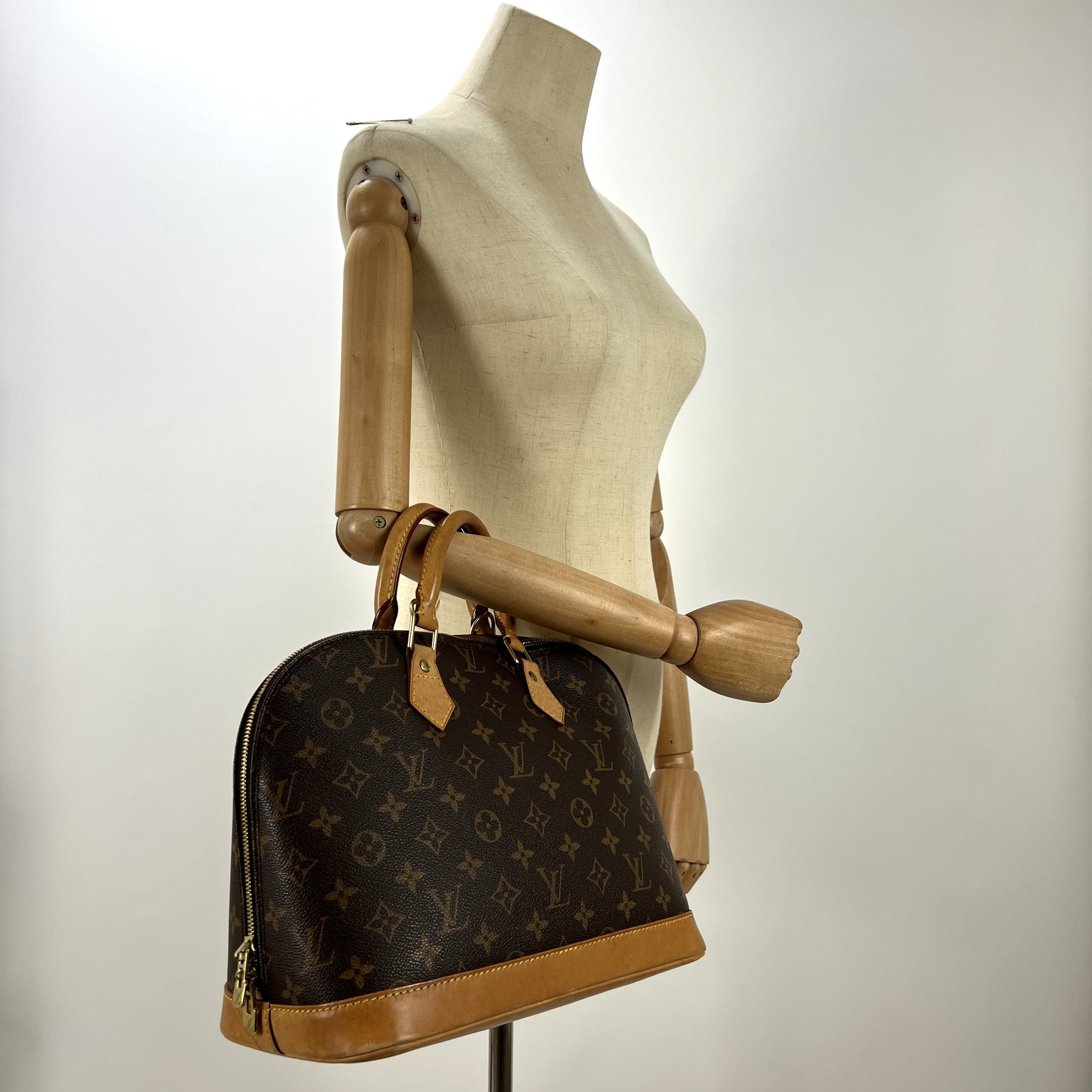 LOUIS VUITTON Alma PM handbag in brown canvas and leather
