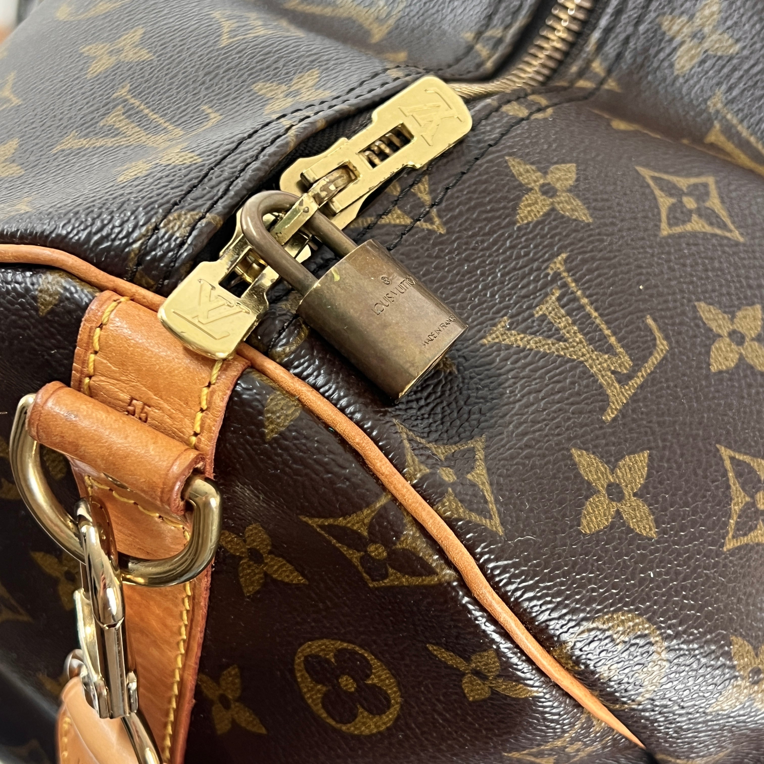 LOUIS VUITTON Keepall 55 canvas and brown leather handbag