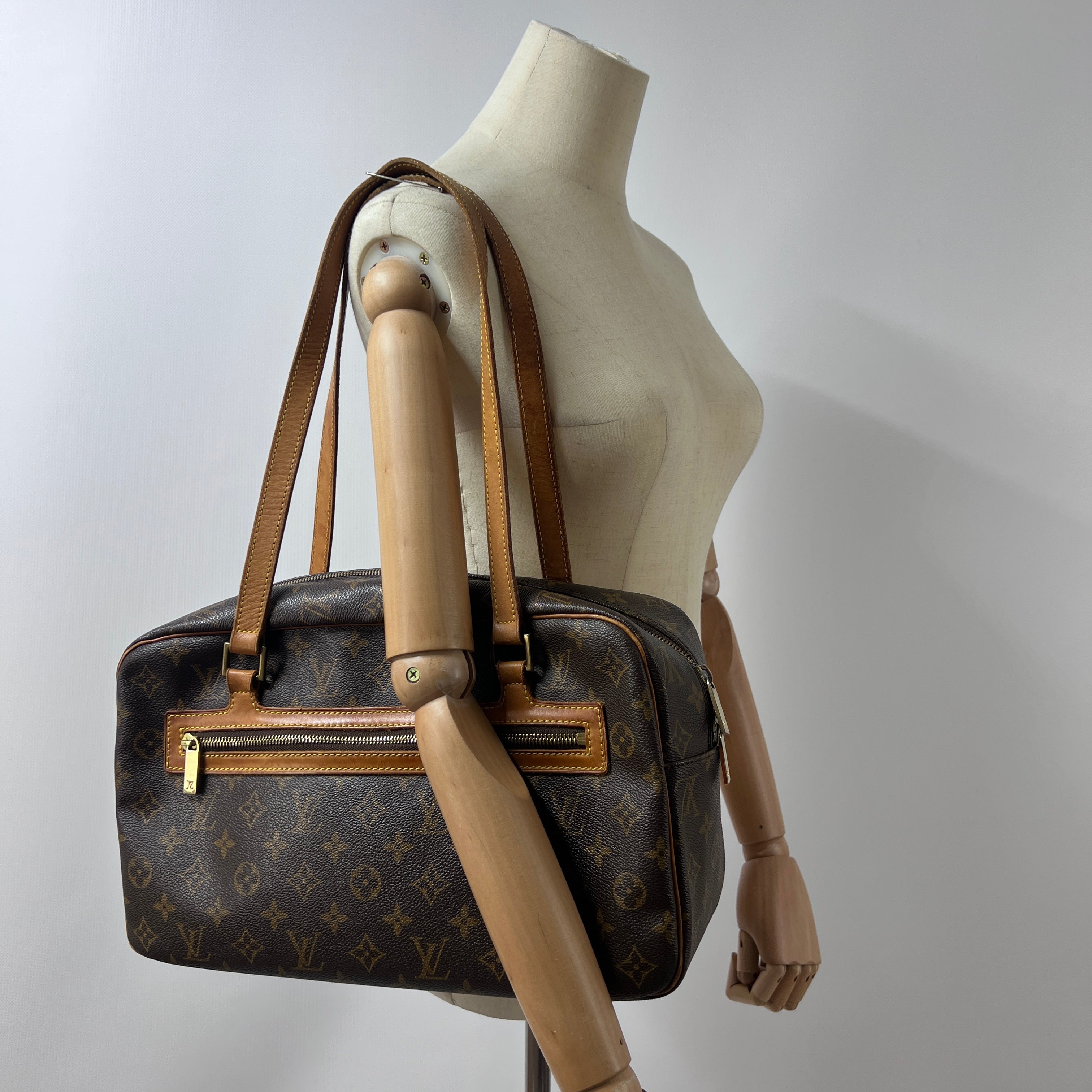 Sac à main LOUIS VUITTON Cité MM toile et cuir marron