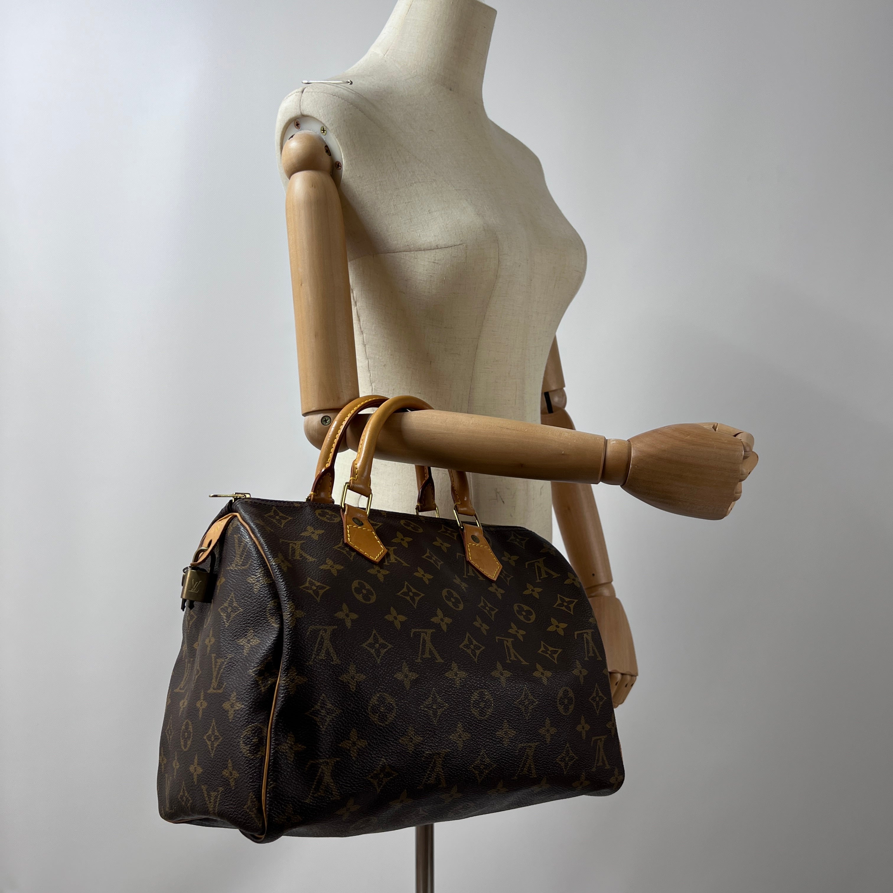 LOUIS VUITTON Speedy 30 canvas and brown leather handbag