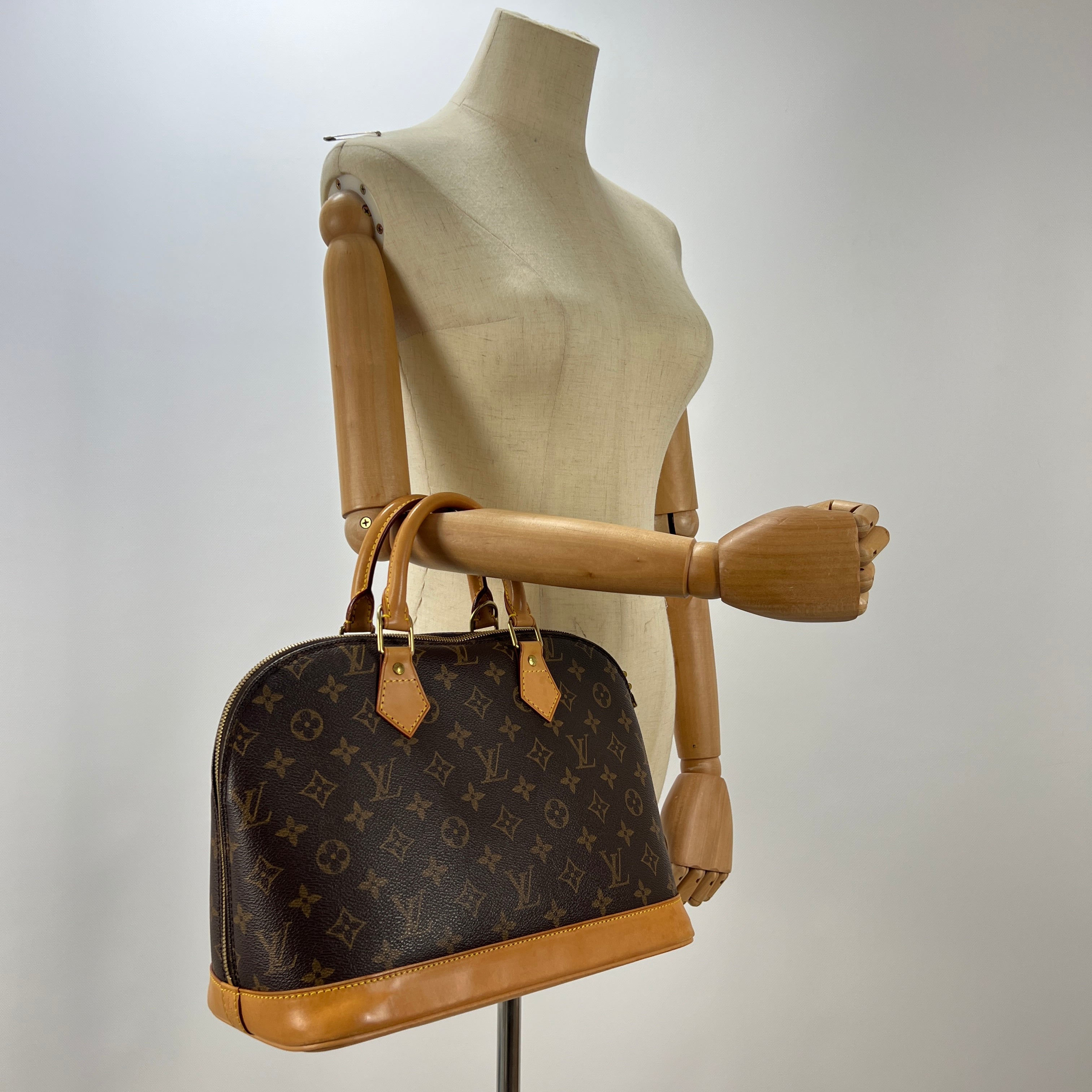 Sac à main LOUIS VUITTON Alma toile et cuir marron