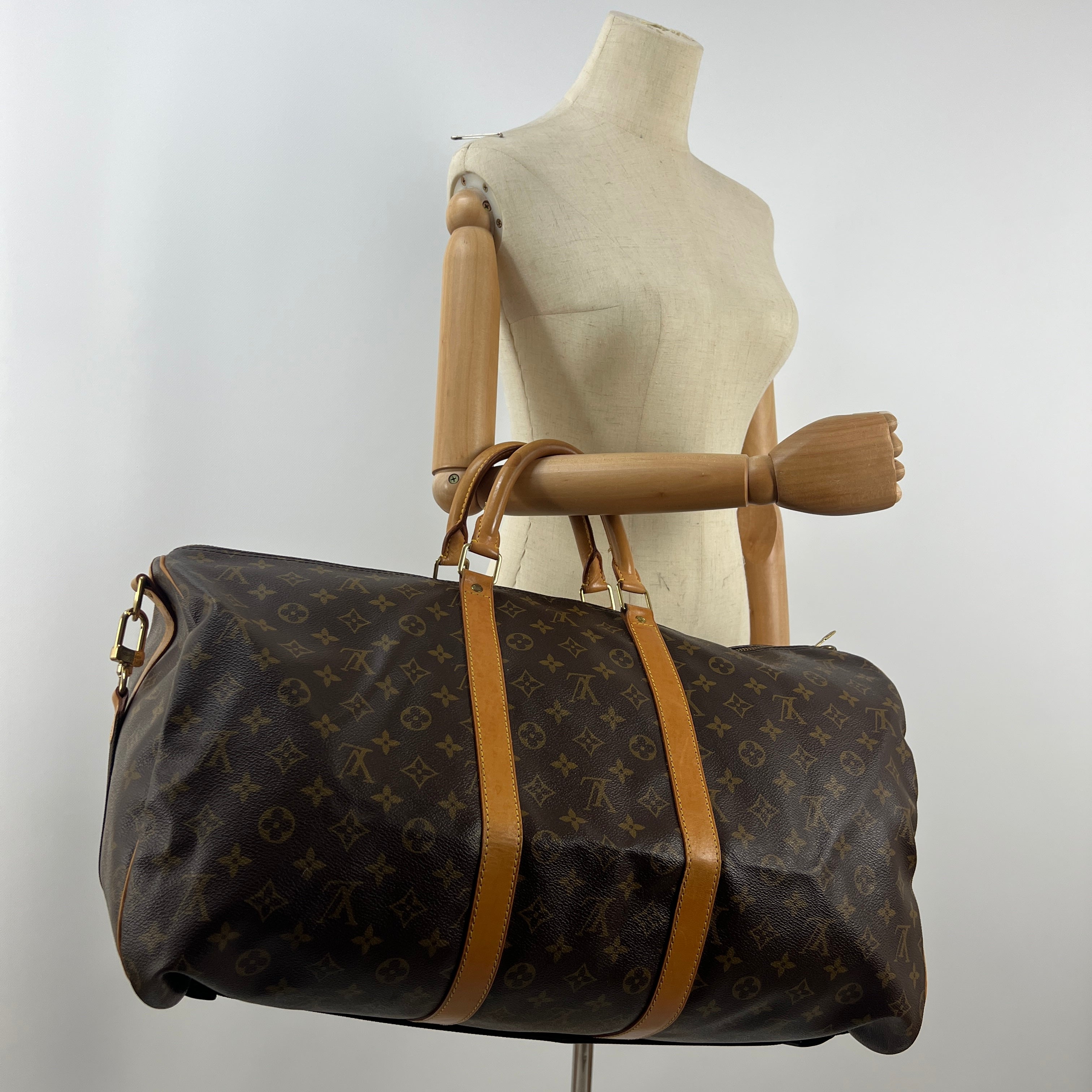LOUIS VUITTON Keepall 55 canvas and brown leather handbag