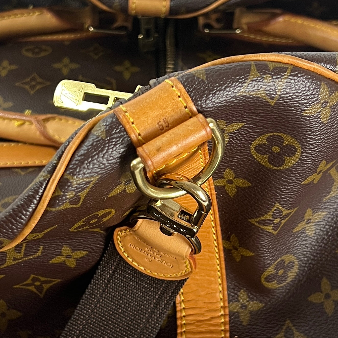 LOUIS VUITTON Keepall 55 canvas and brown leather handbag