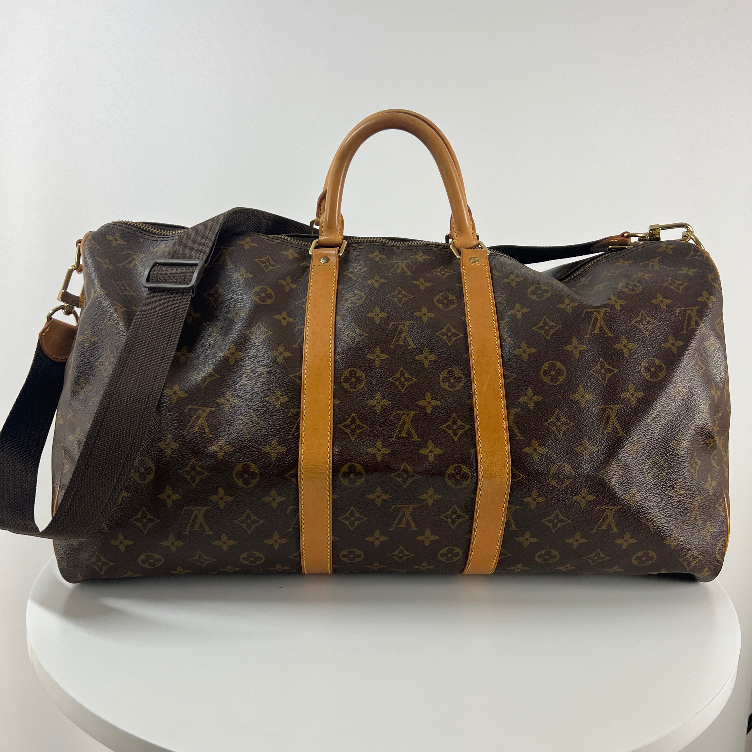 LOUIS VUITTON Keepall 55 canvas and brown leather handbag