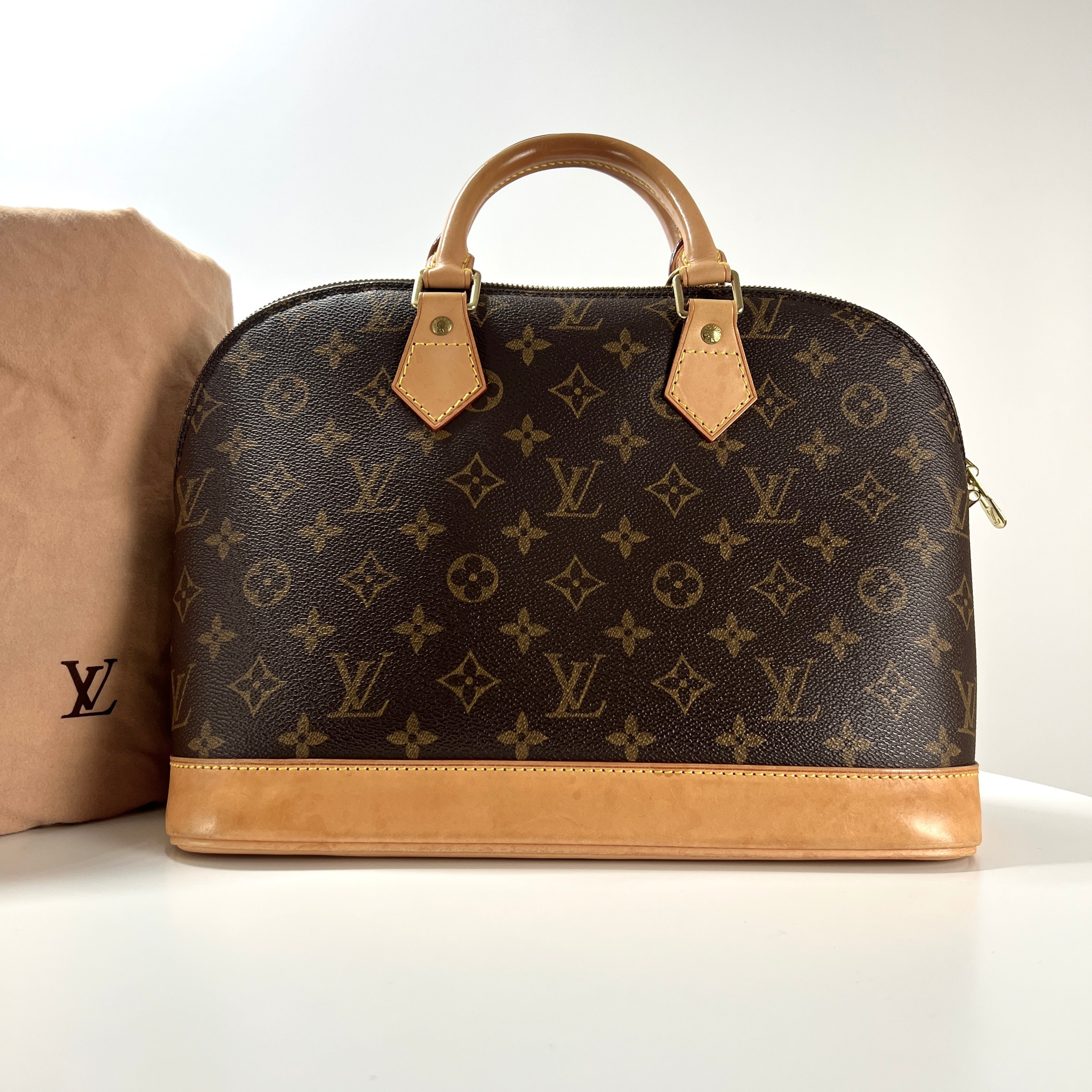 Sac à main LOUIS VUITTON Alma toile et cuir marron