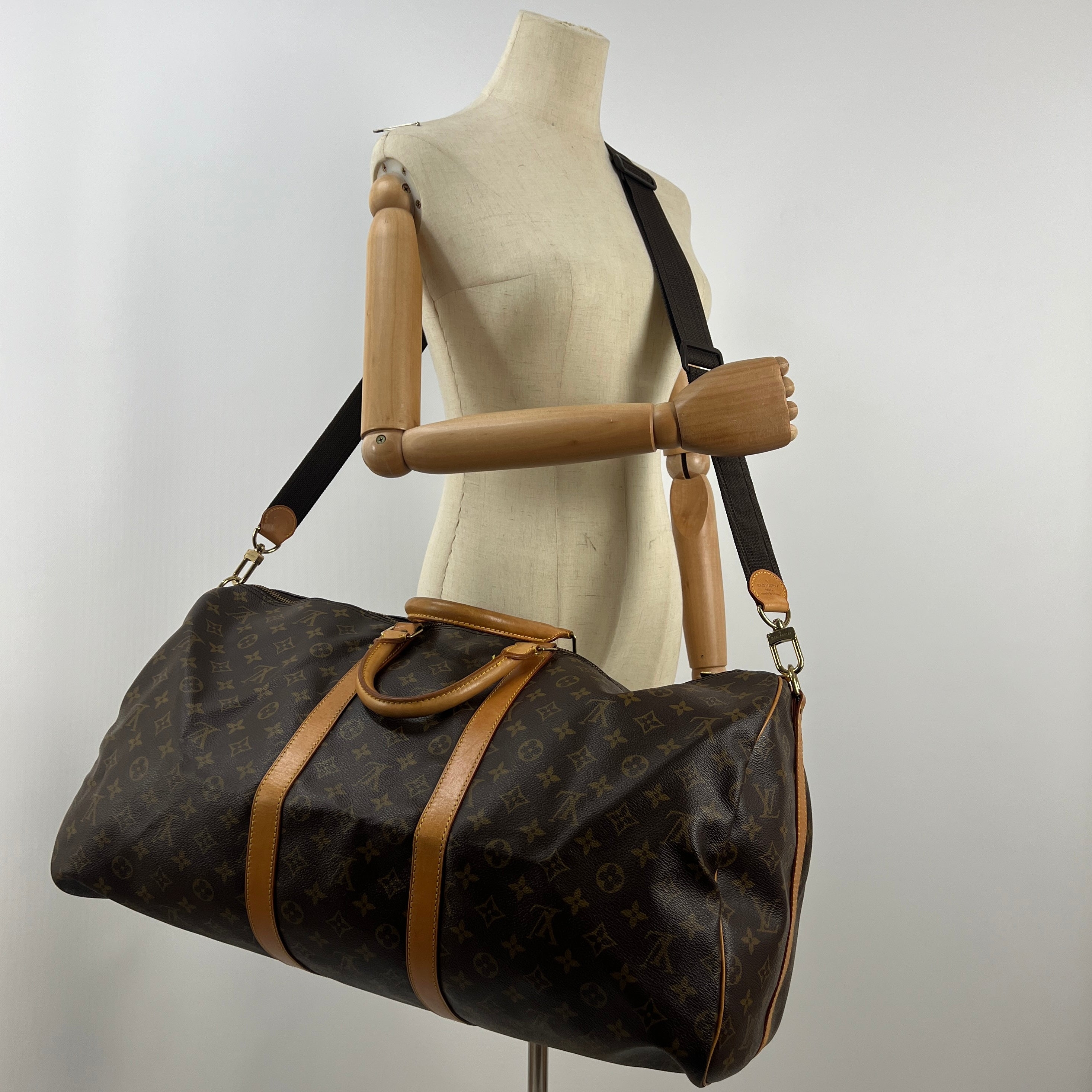LOUIS VUITTON Keepall 55 canvas and brown leather handbag