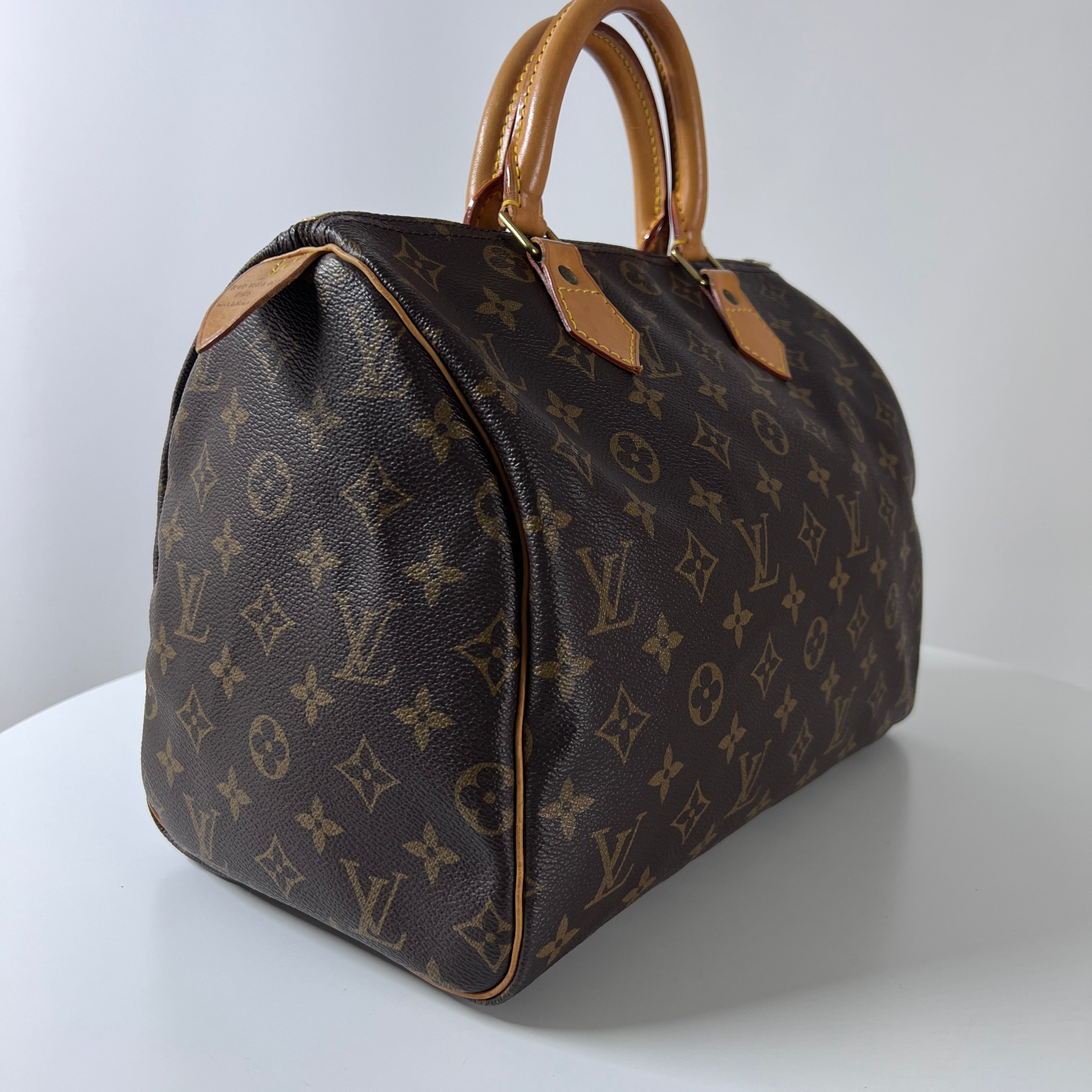 LOUIS VUITTON Speedy 30 canvas and brown leather handbag