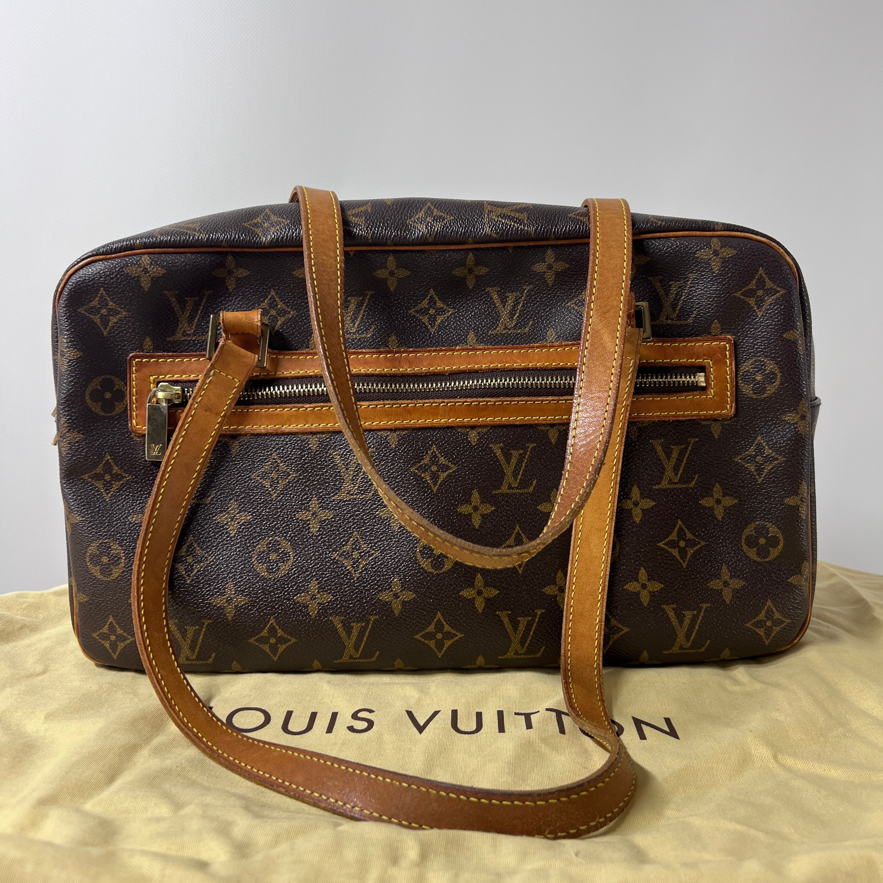 Sac à main LOUIS VUITTON Cité MM toile et cuir marron