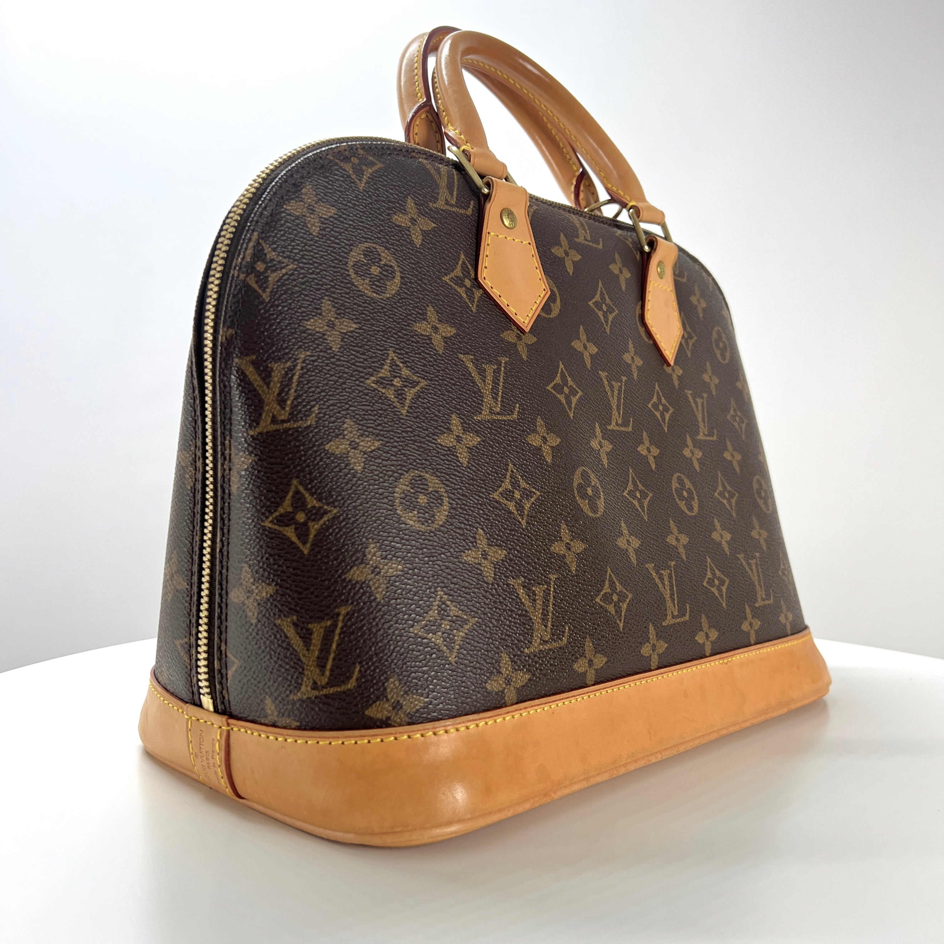 Sac à main LOUIS VUITTON Alma toile et cuir marron