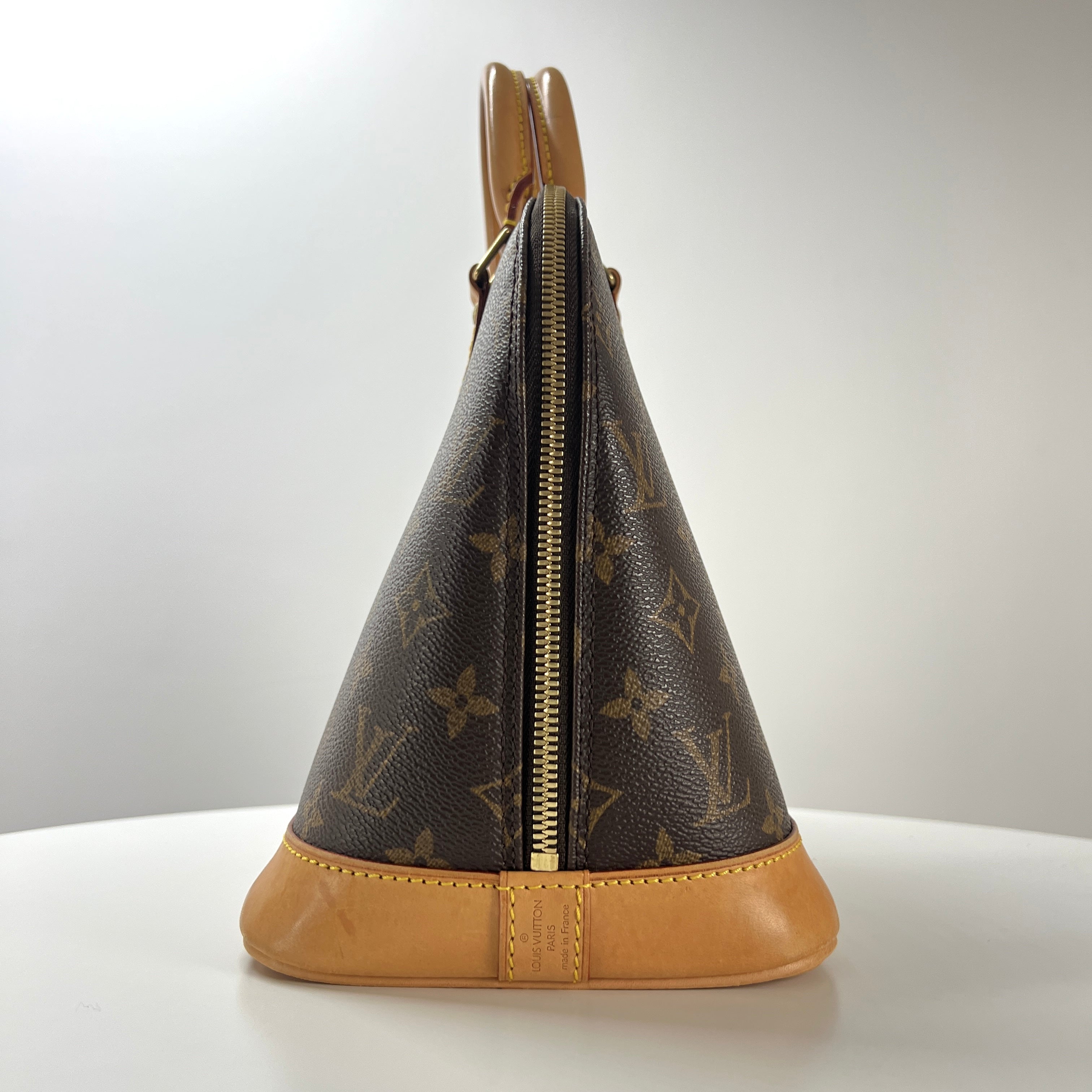 Sac à main LOUIS VUITTON Alma toile et cuir marron