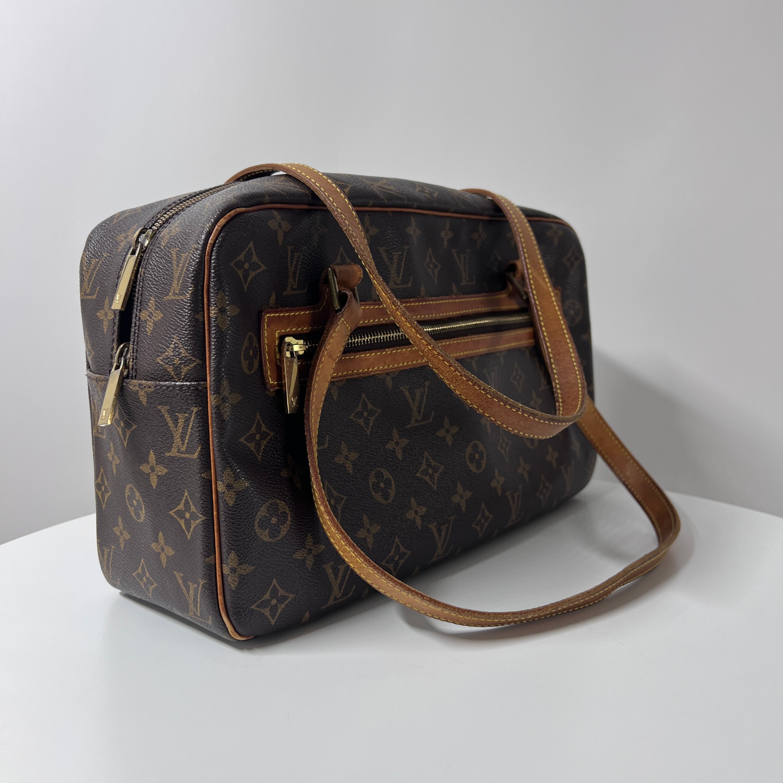 Sac à main LOUIS VUITTON Cité MM toile et cuir marron