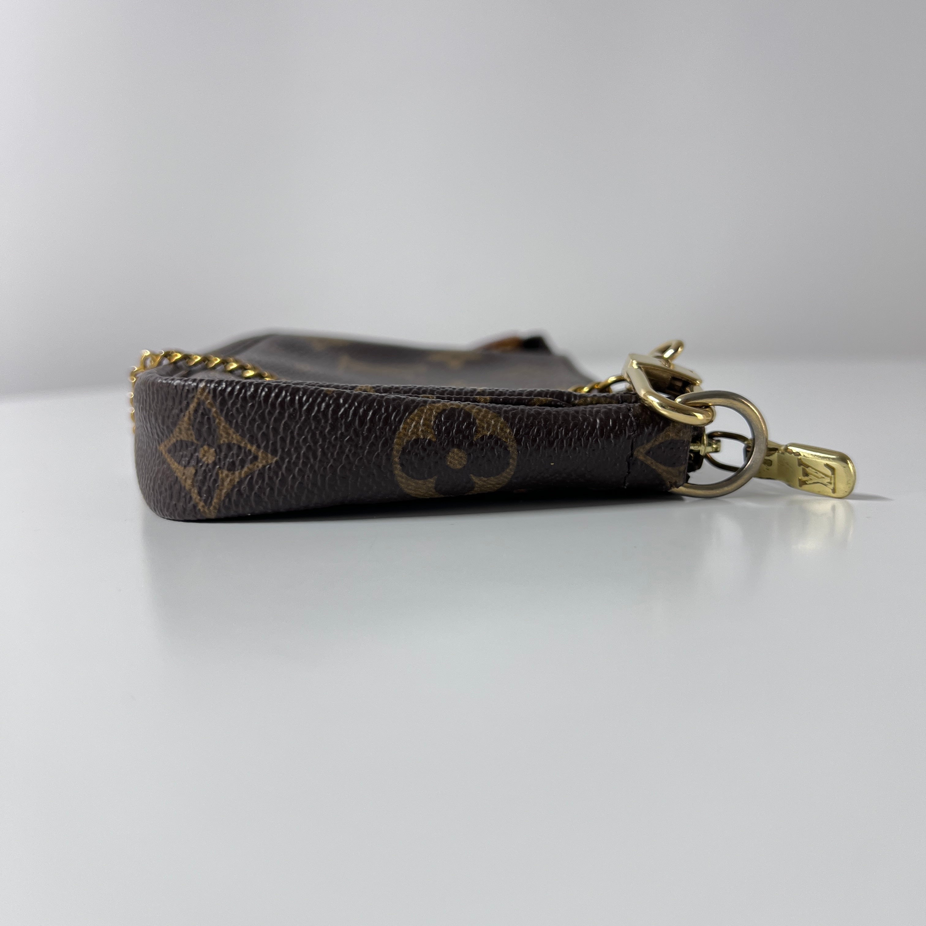Sac à main LOUIS VUITTON Accessory Pouch toile et cuir marron