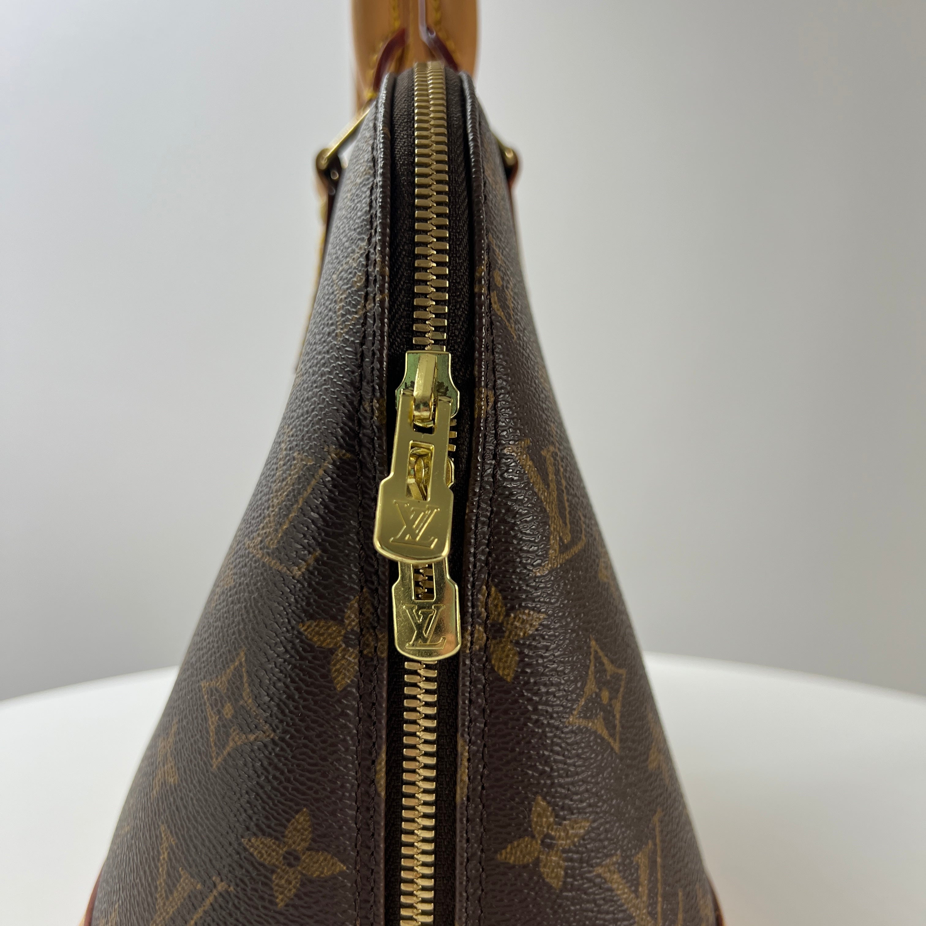 Sac à main LOUIS VUITTON Alma toile et cuir marron