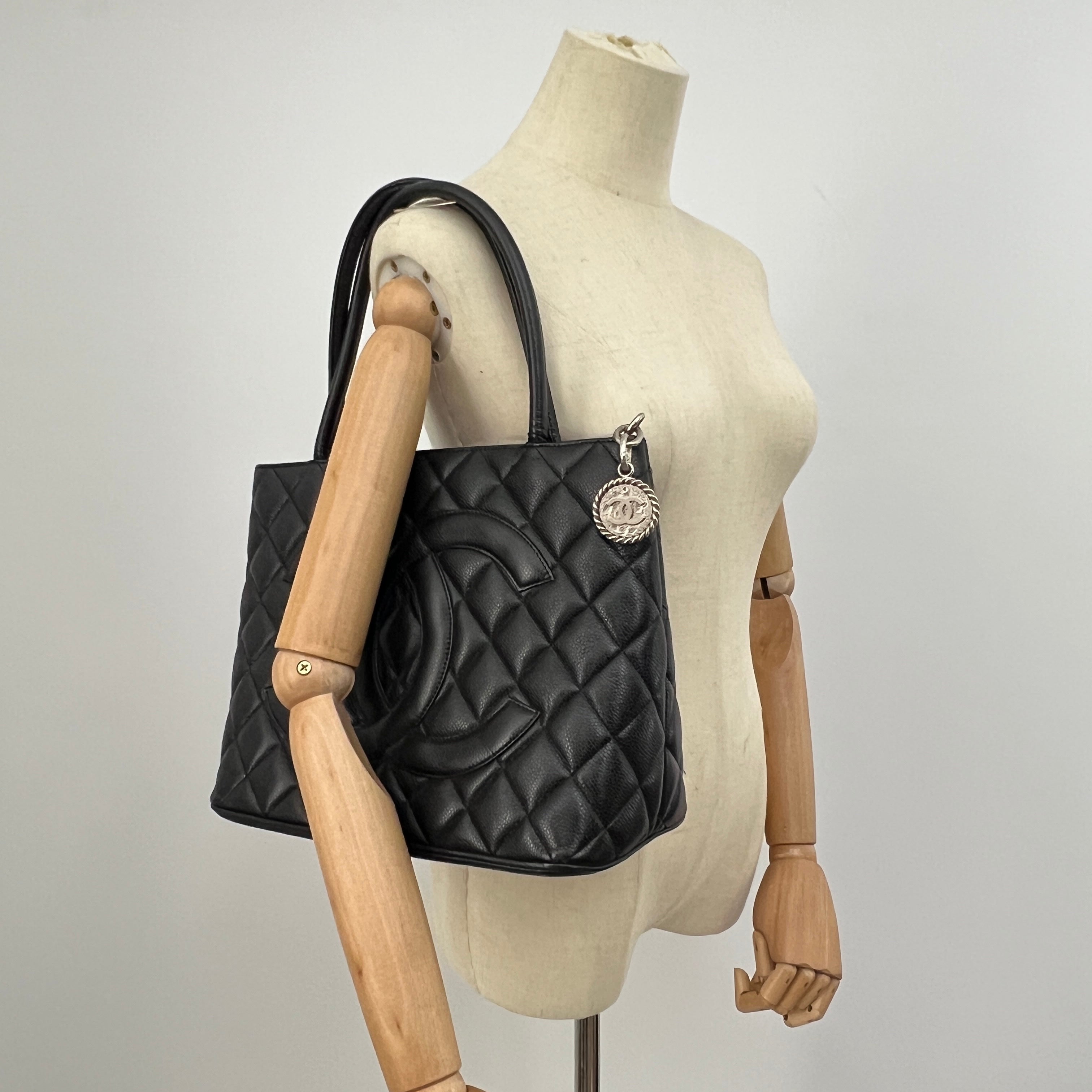 CHANEL Medallion bag in black caviar leather