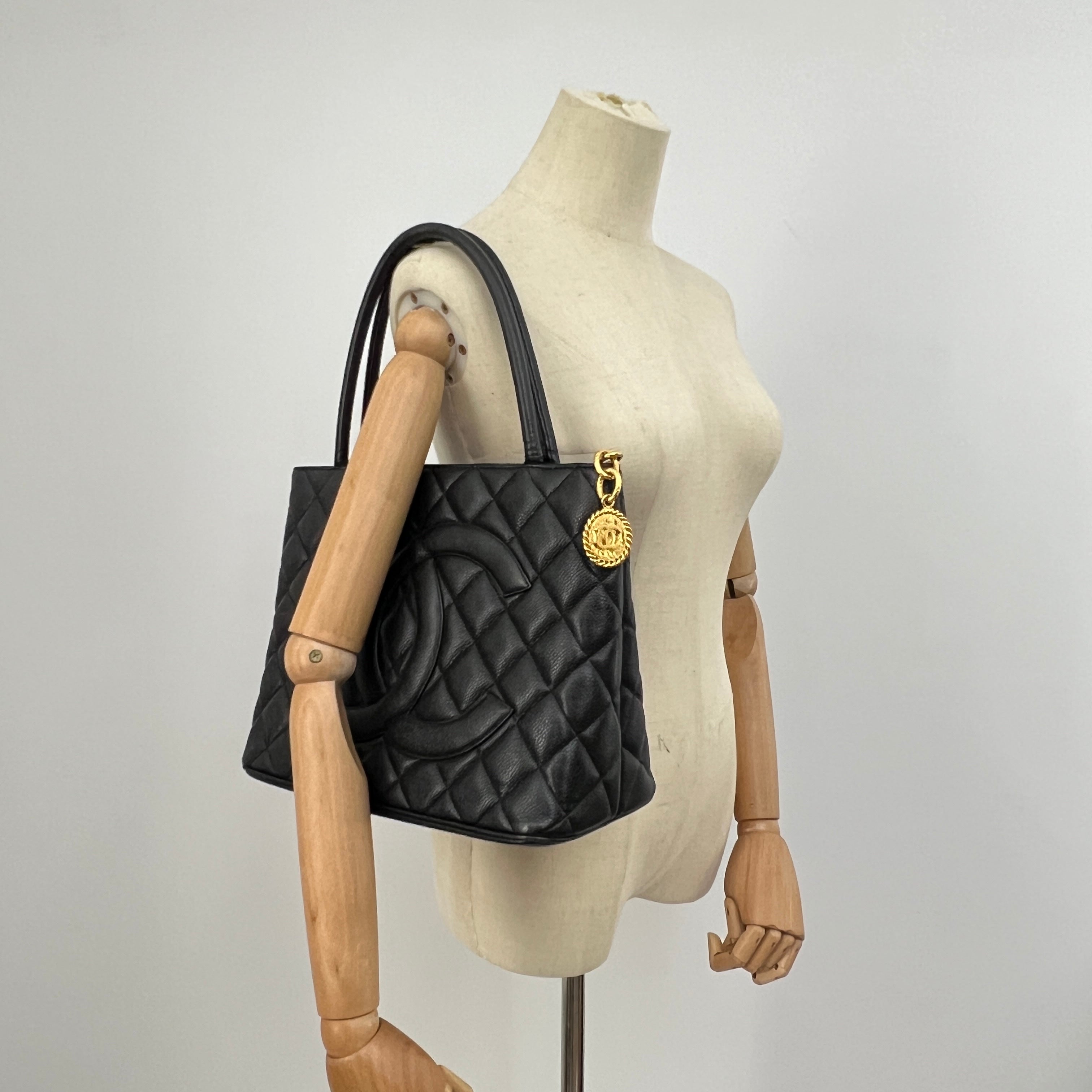 CHANEL Medallion bag in black caviar leather
