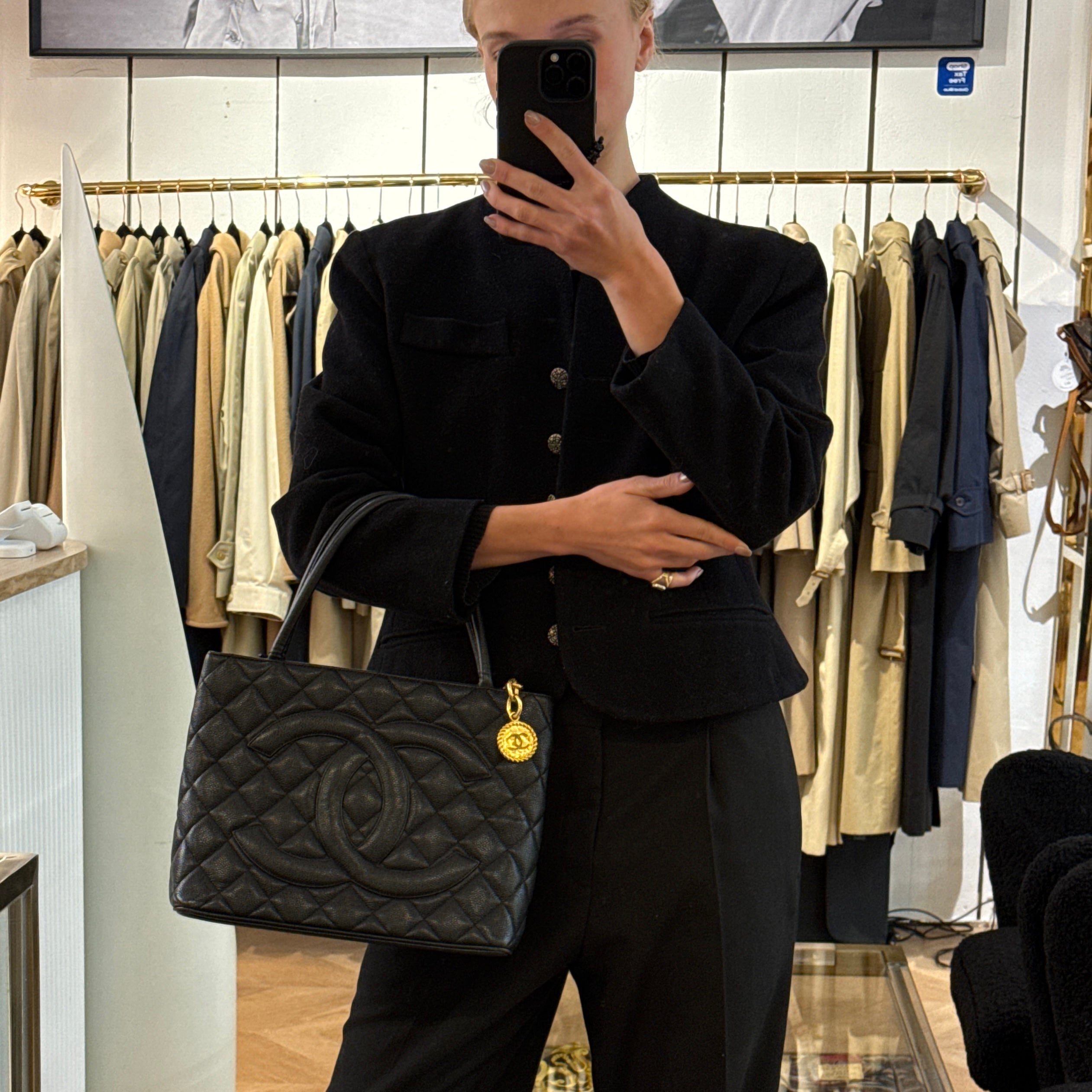 CHANEL Medallion bag in black caviar leather