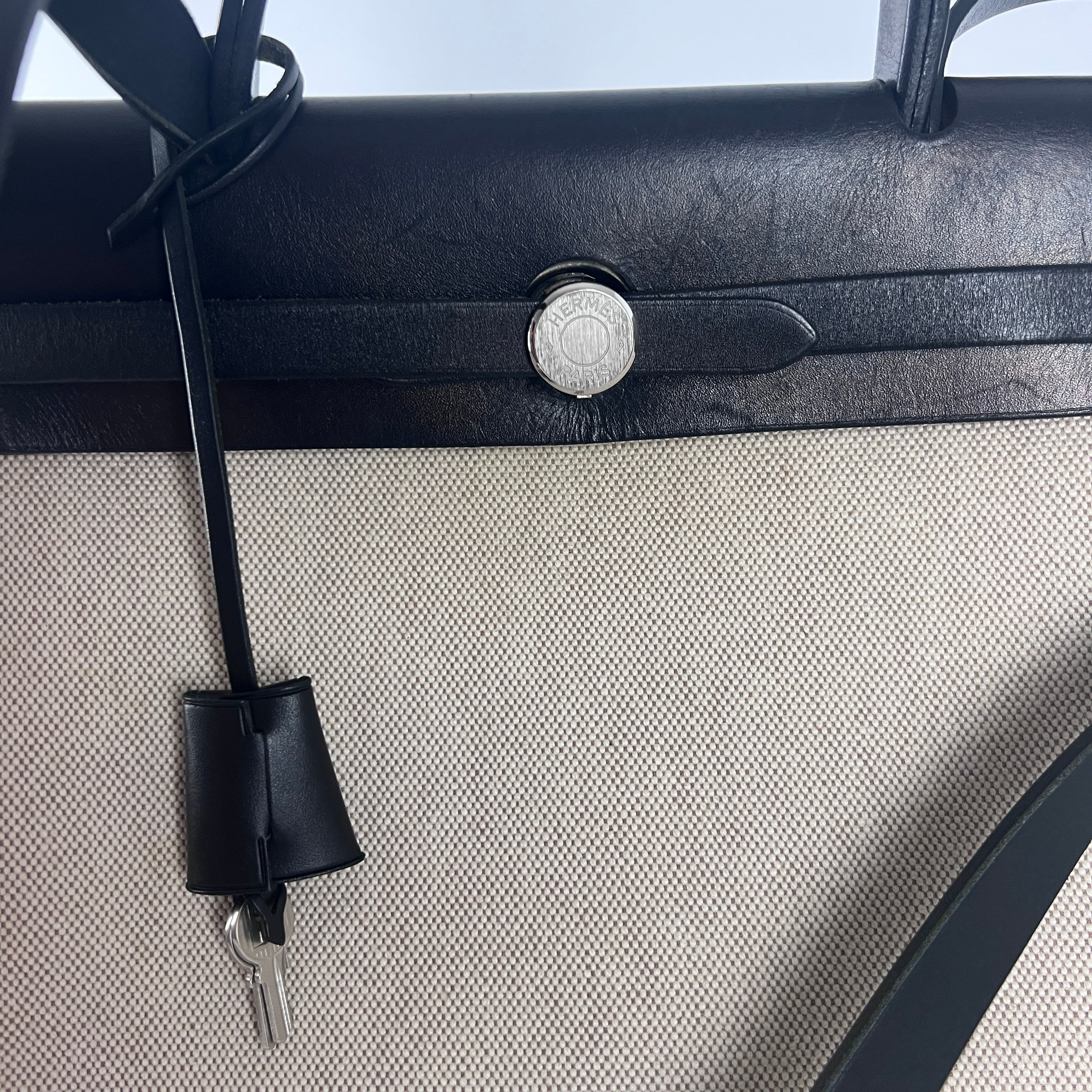 HERMÈS Herbag canvas and black leather handbag