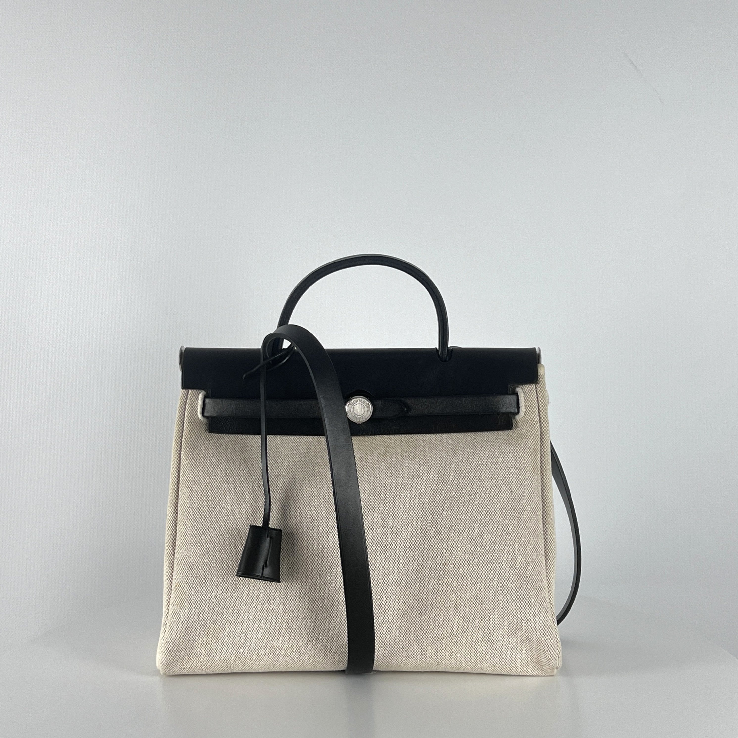 HERMÈS Herbag canvas and black leather handbag