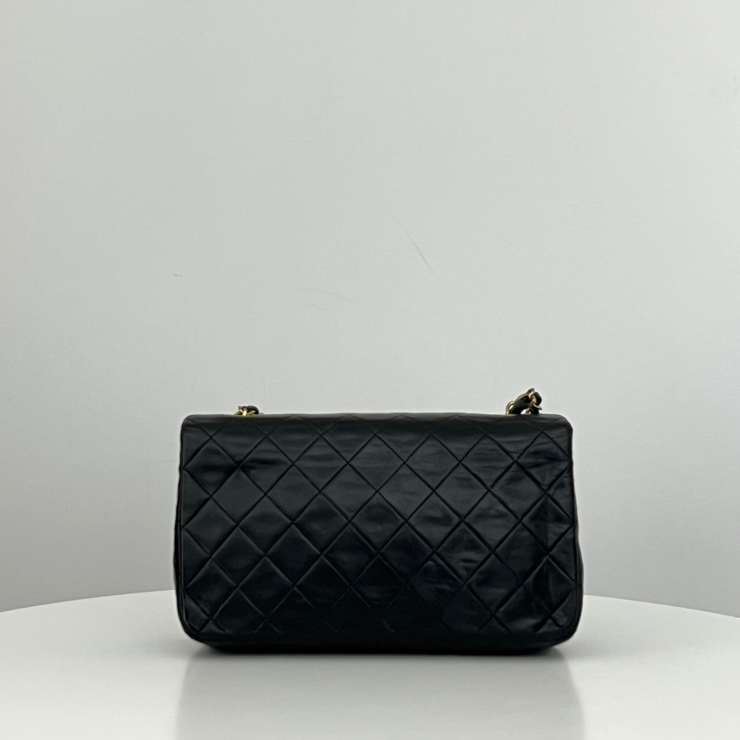CHANEL Classic Small Shoulder Bag in black lambskin