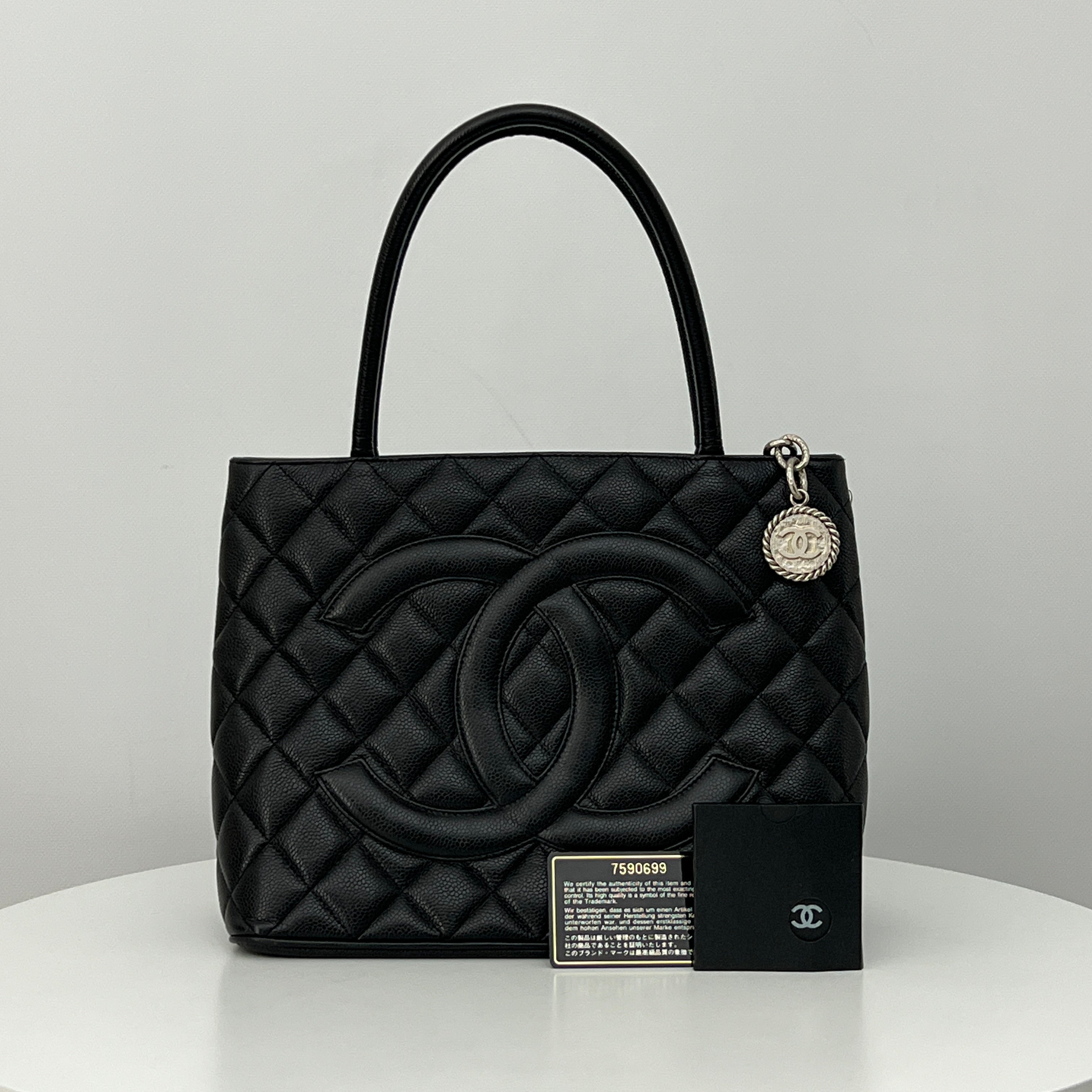 CHANEL Medallion bag in black caviar leather
