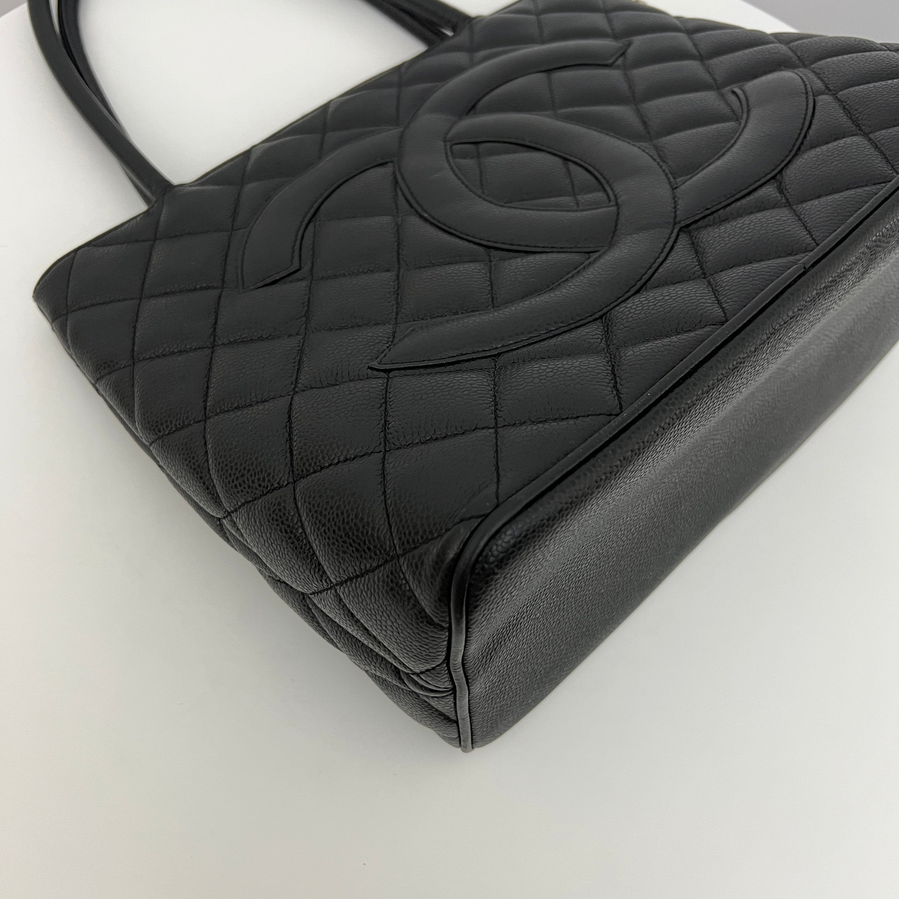CHANEL Medallion bag in black caviar leather