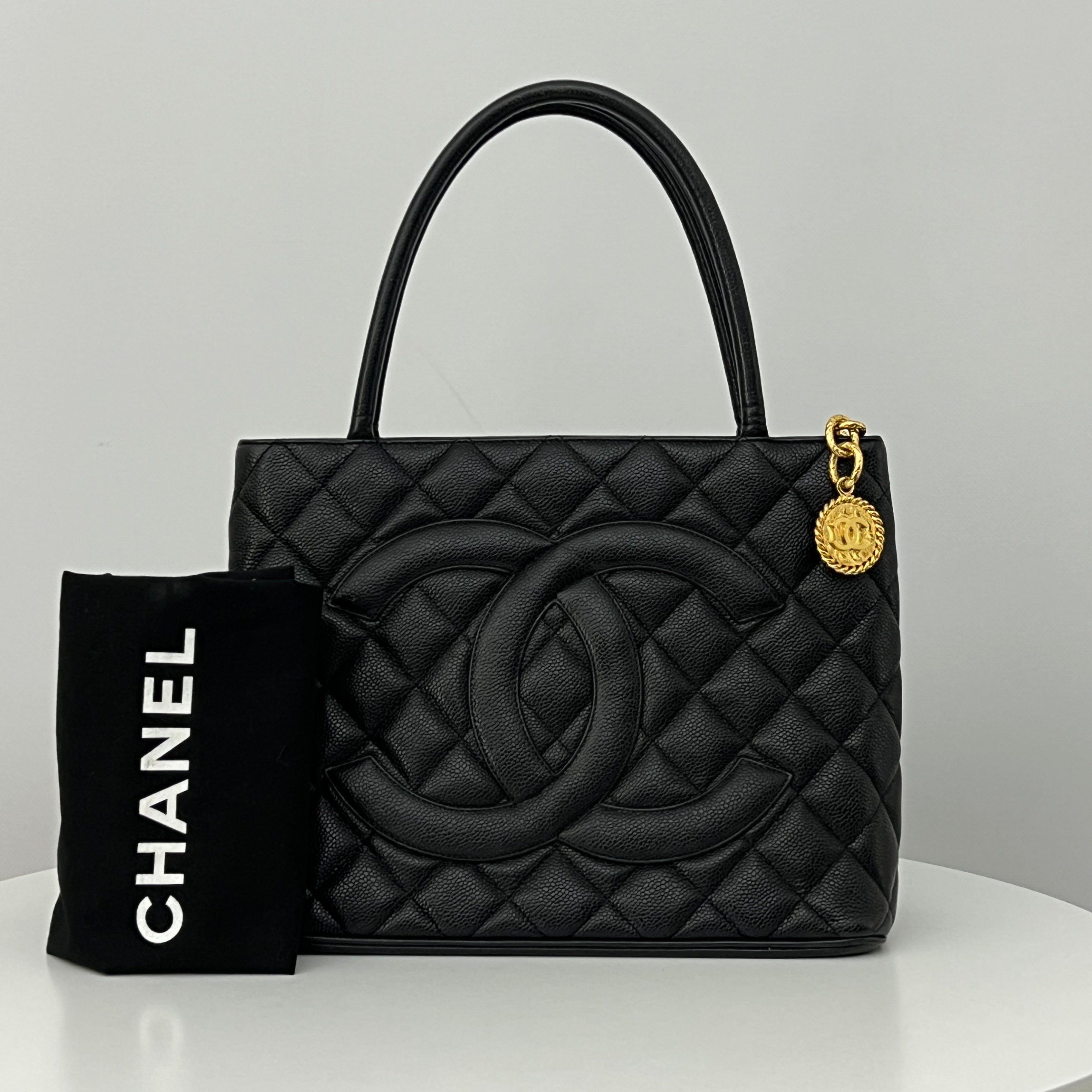 CHANEL Medallion bag in black caviar leather