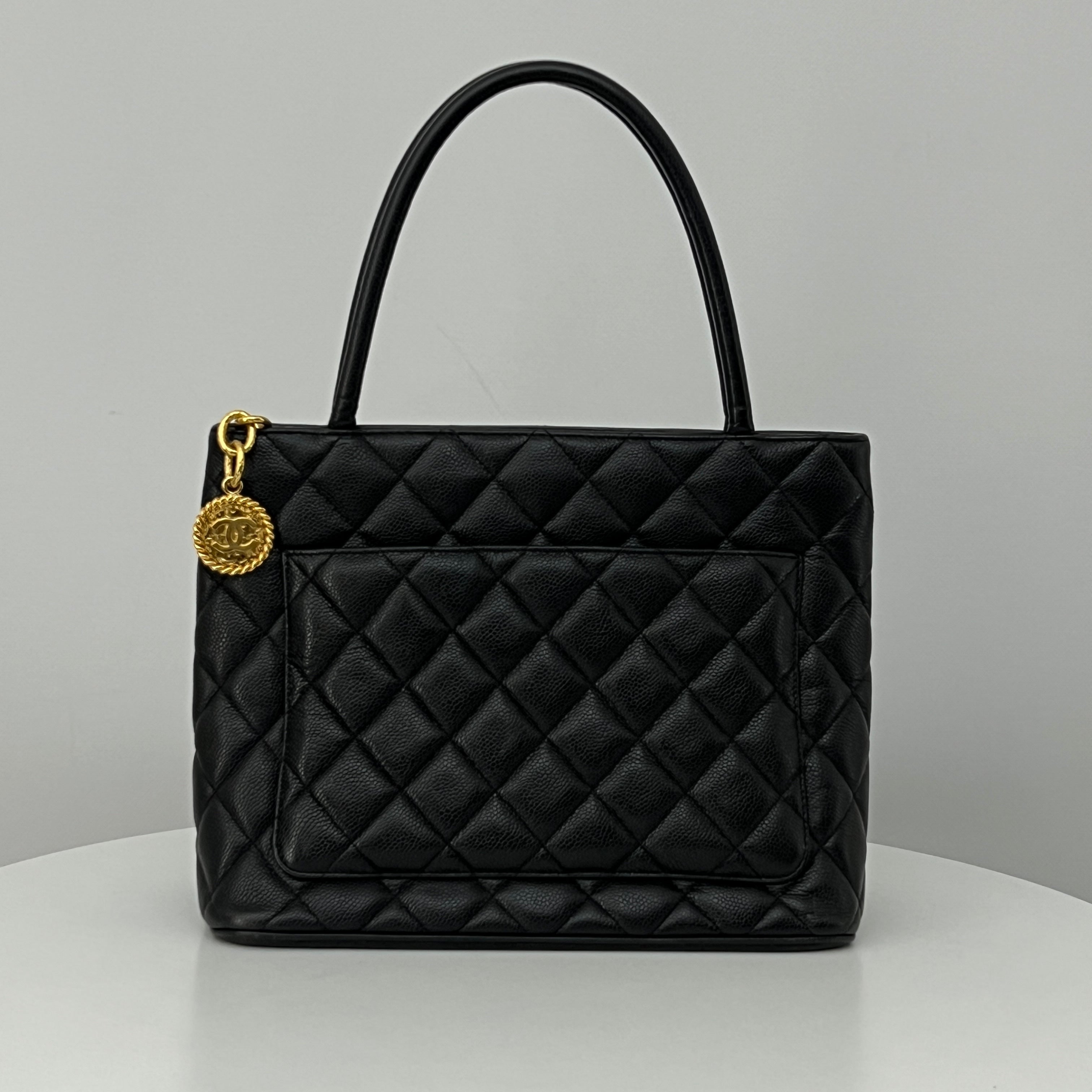 CHANEL Medallion bag in black caviar leather