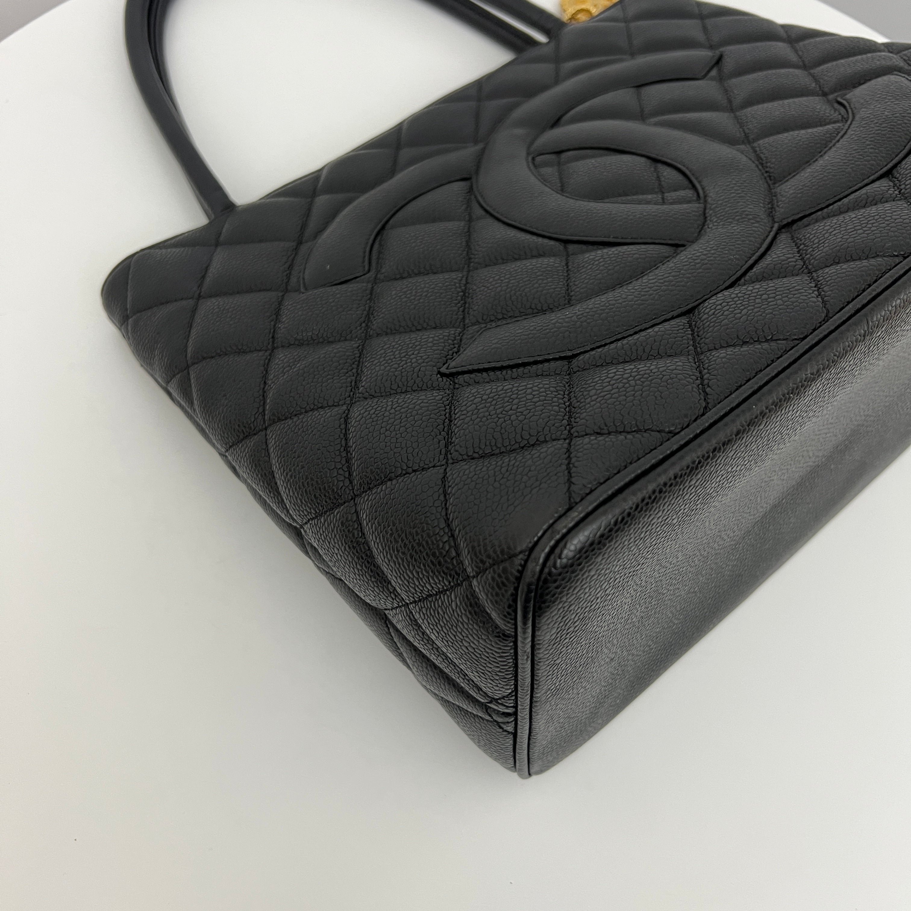 CHANEL Medallion bag in black caviar leather