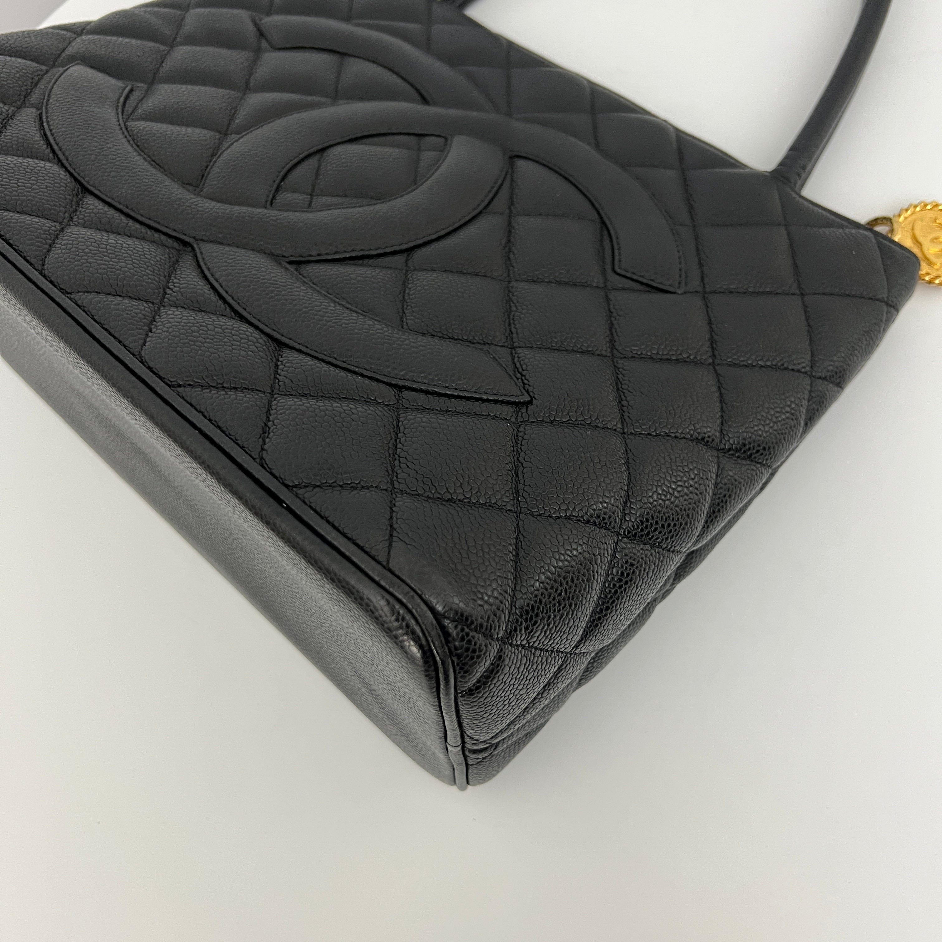 CHANEL Medallion bag in black caviar leather