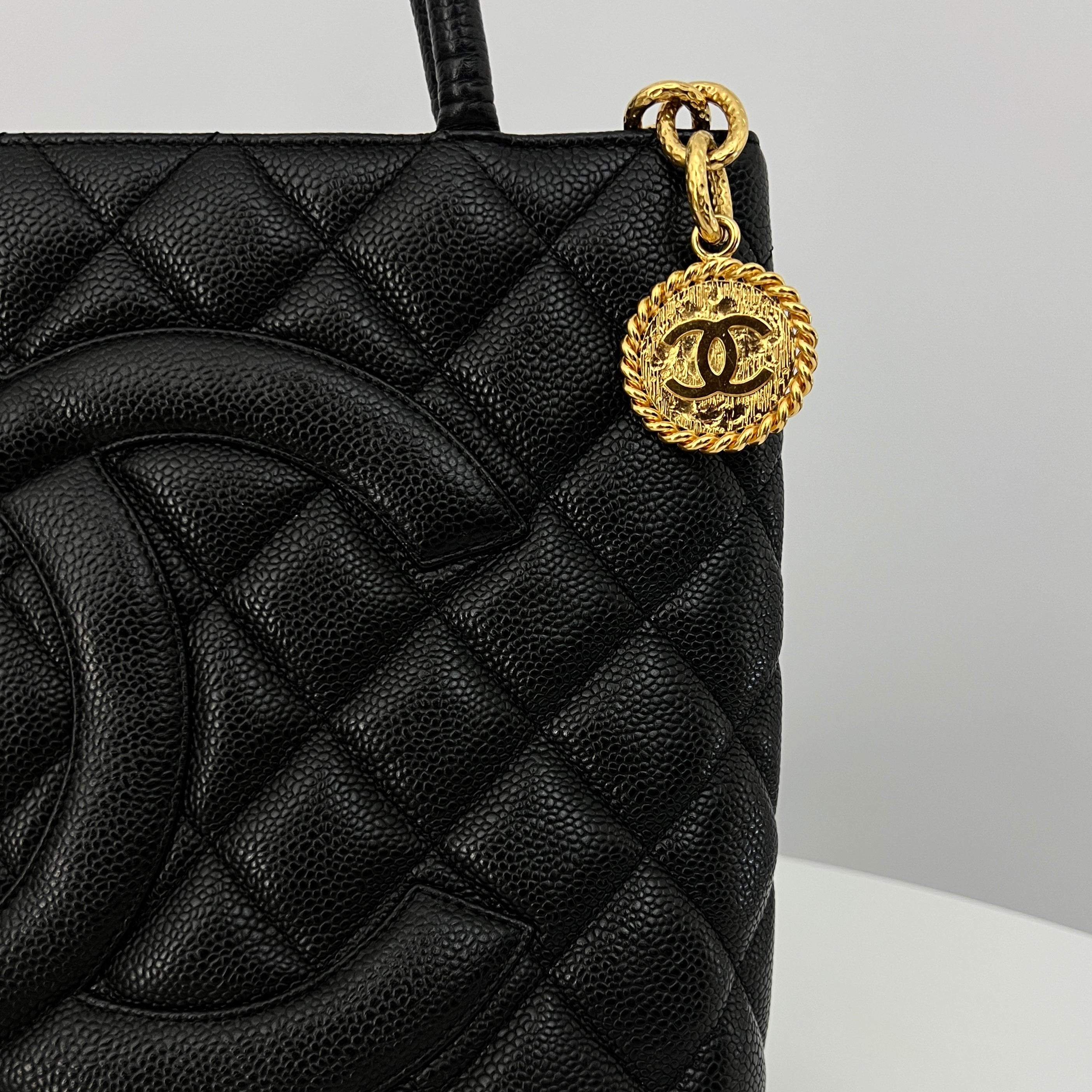 CHANEL Medallion bag in black caviar leather