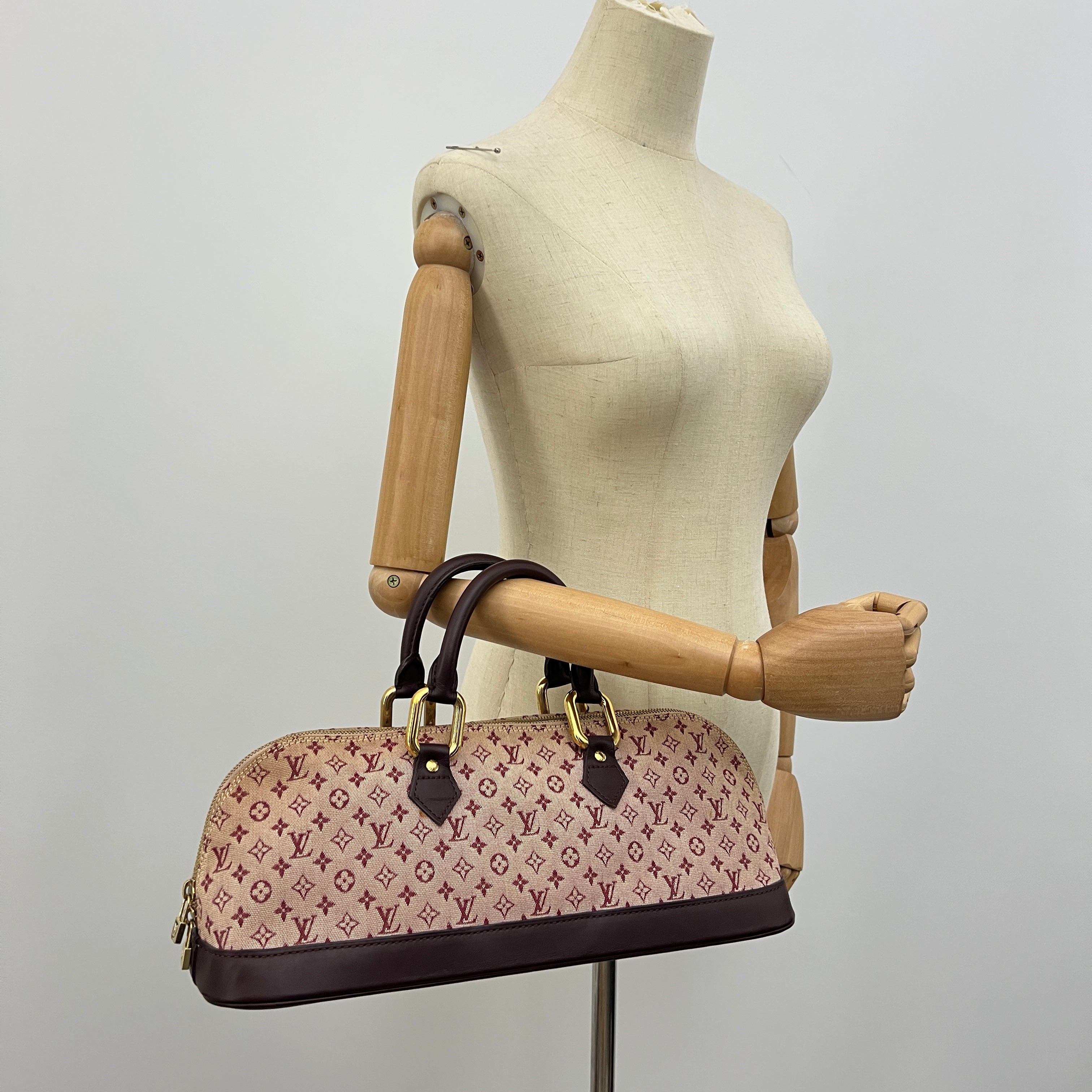 LOUIS VUITTON Alma Long bag in pink canvas and leather