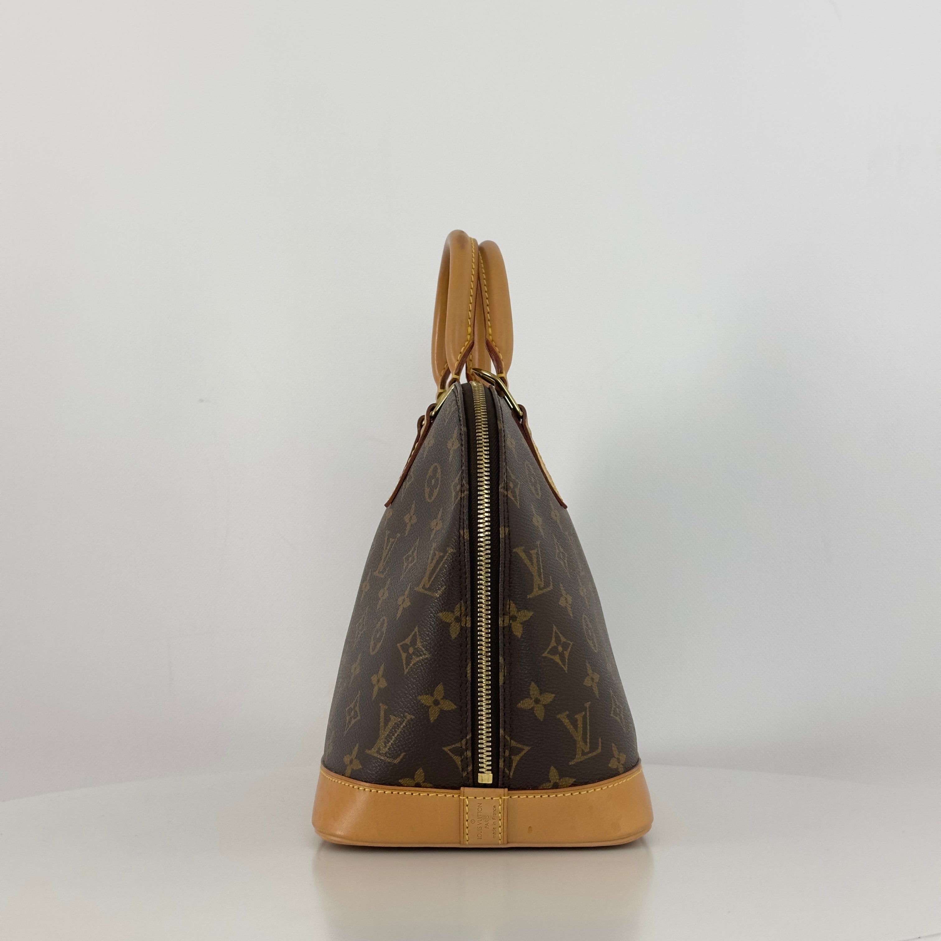 LOUIS VUITTON Alma MM handbag in brown canvas and leather