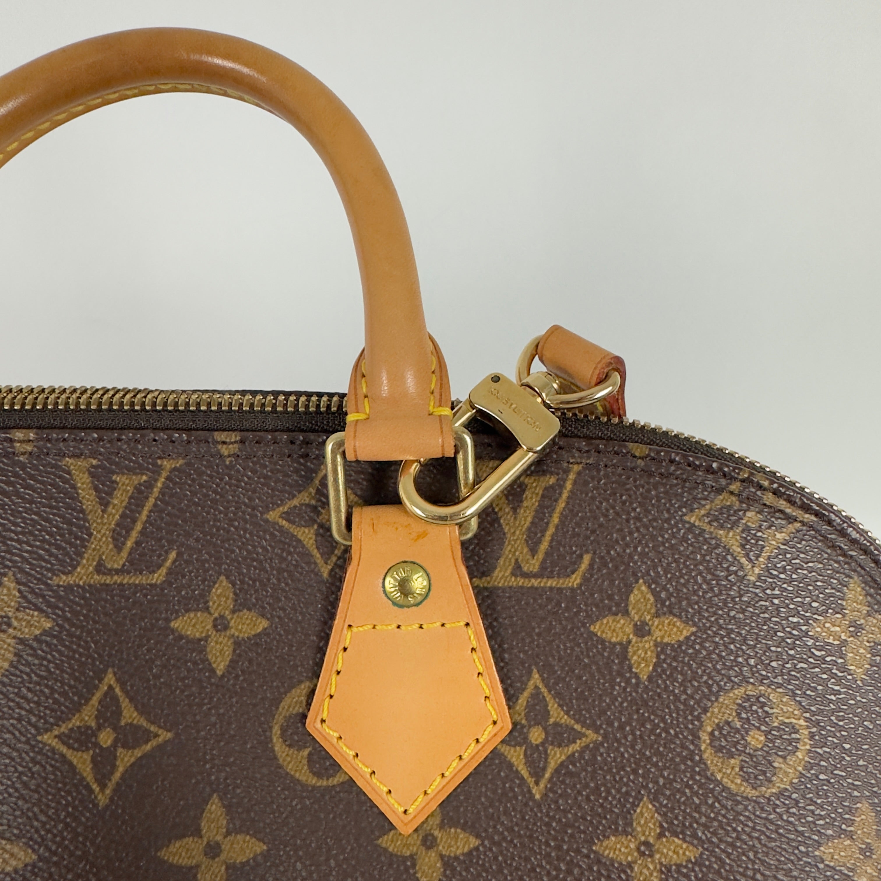 LOUIS VUITTON Alma MM handbag in brown canvas and leather