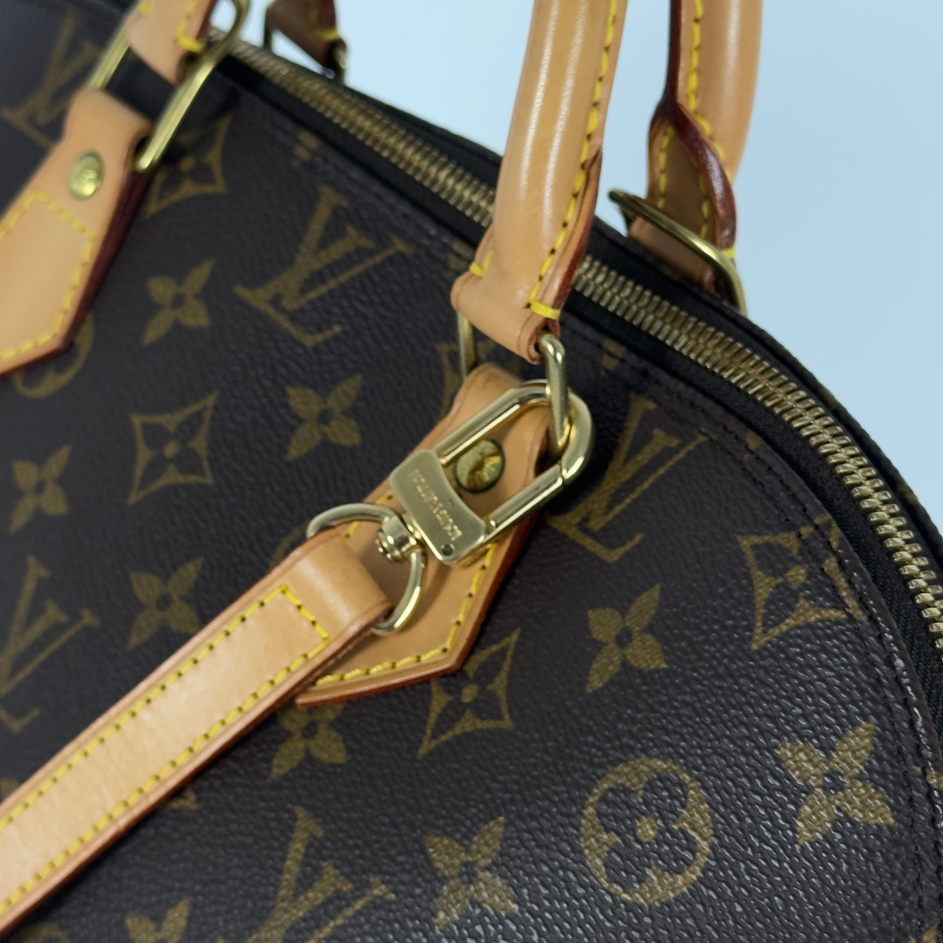 LOUIS VUITTON Alma MM handbag in brown canvas and leather