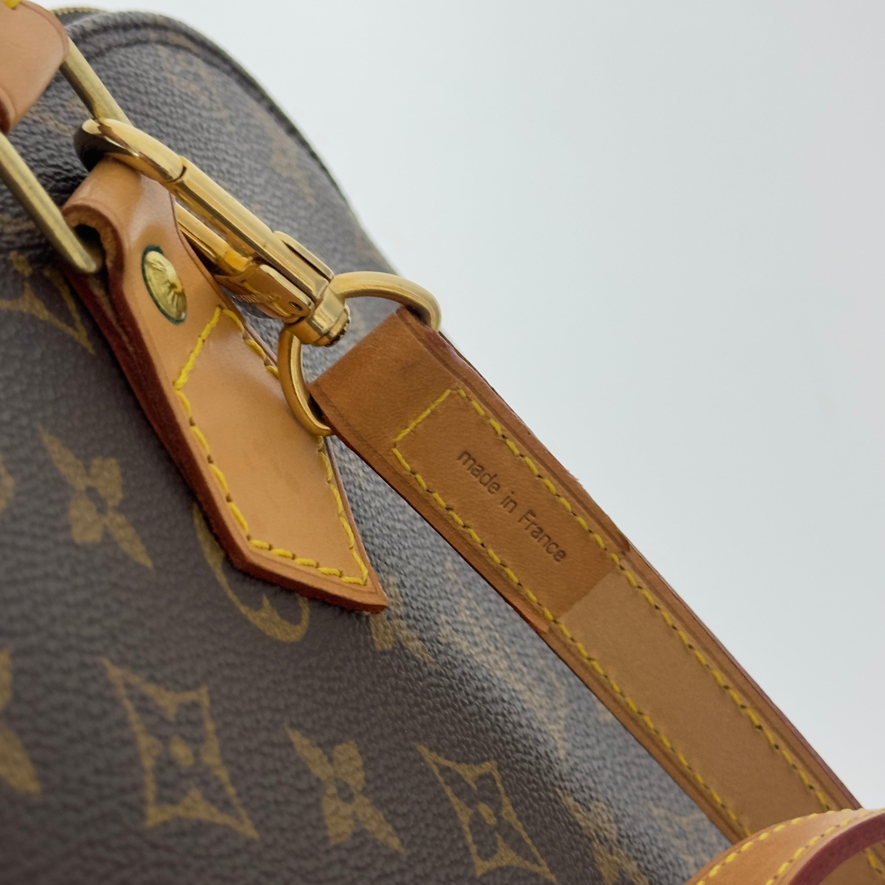 LOUIS VUITTON Alma MM handbag in brown canvas and leather