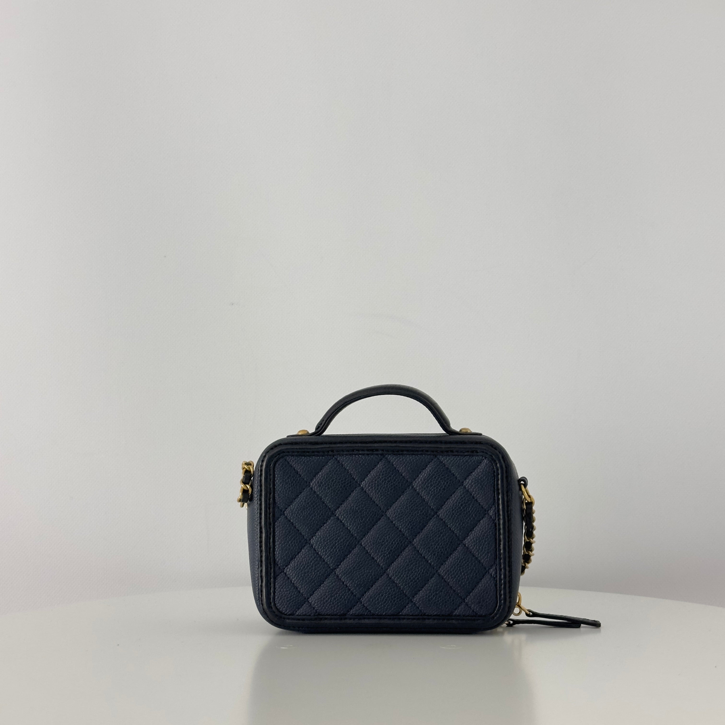 CHANEL Filigree Vanity Case handbag in midnight blue caviar leather