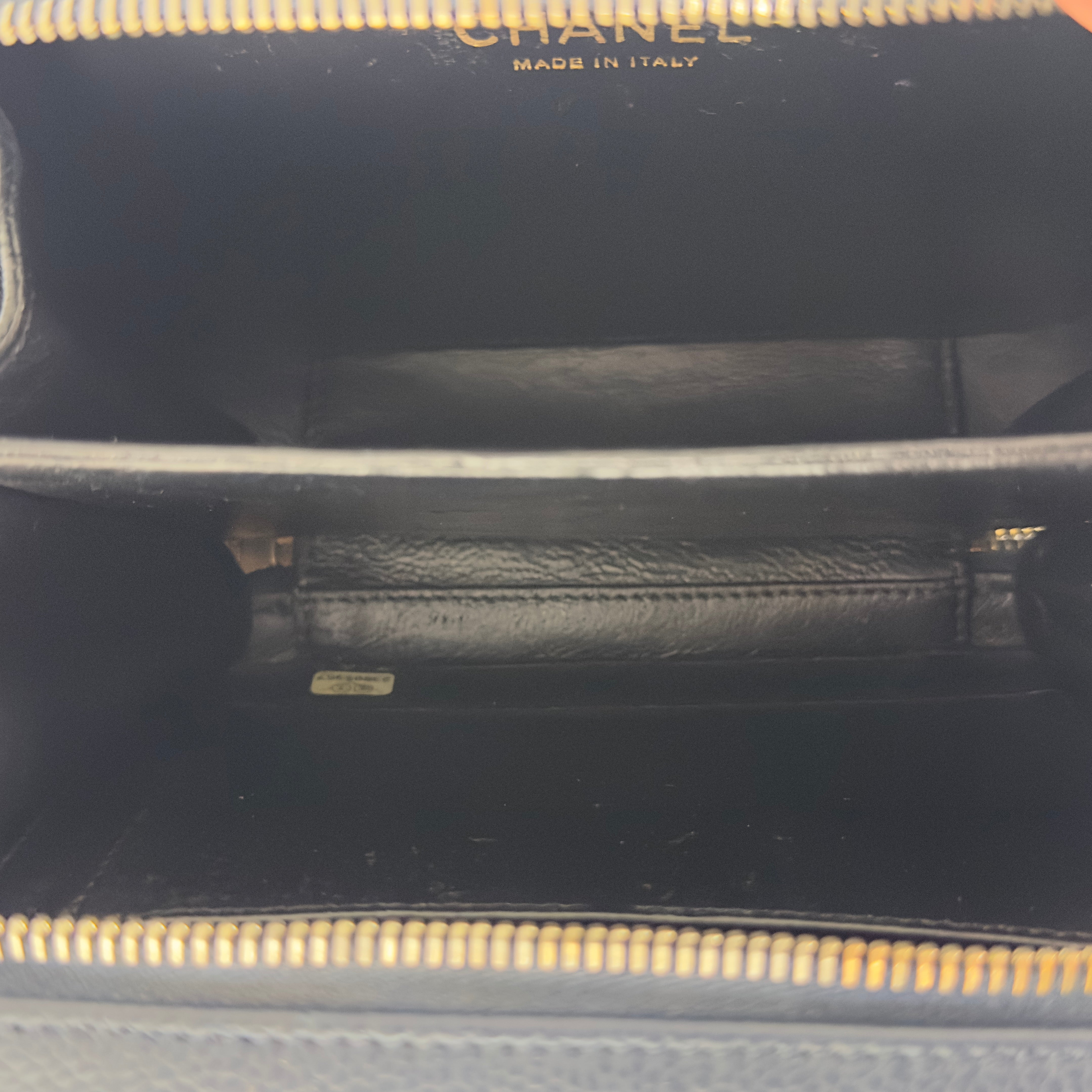 CHANEL Filigree Vanity Case handbag in midnight blue caviar leather