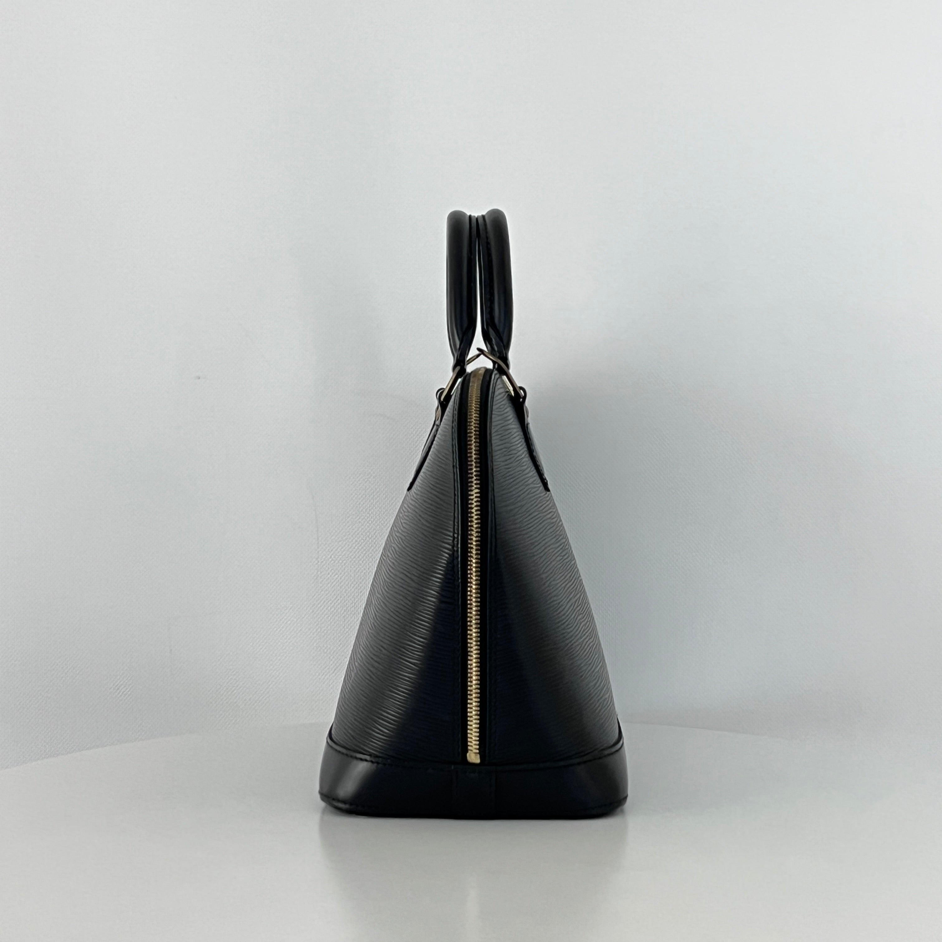 LOUIS VUITTON Alma PM handbag in black Epi leather