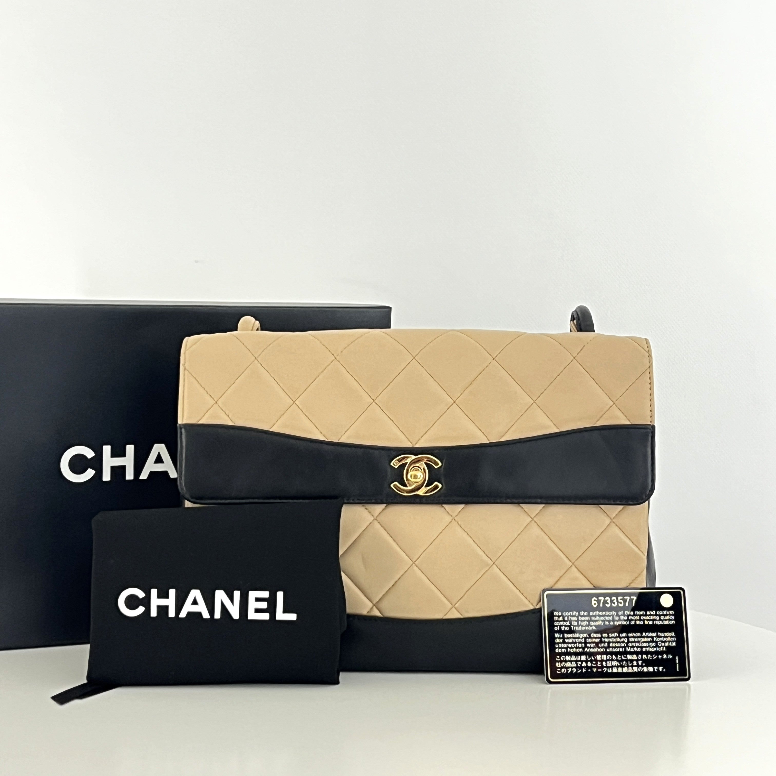Sac à main CHANEL Top Handle cuir d'agneau bicolore